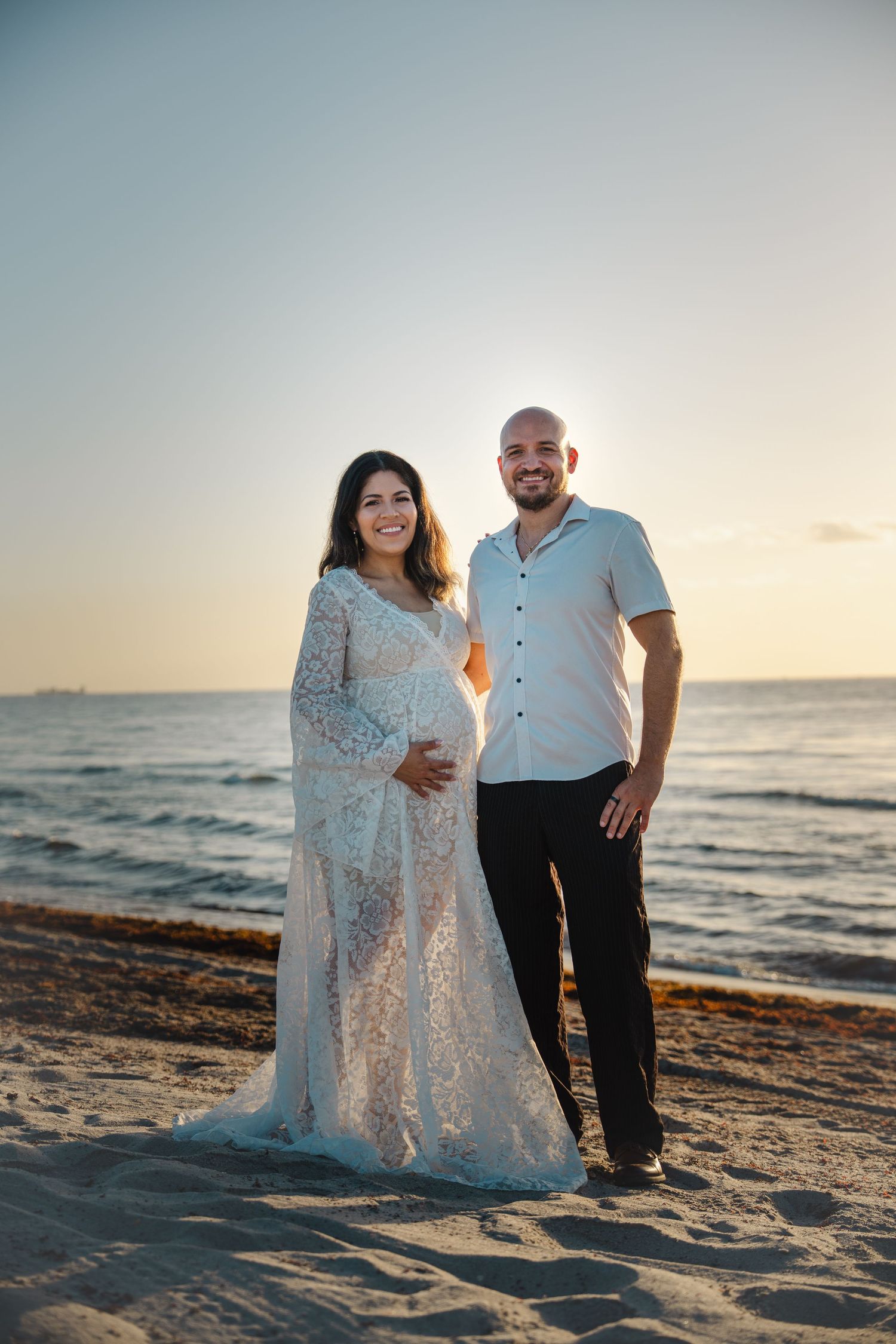 South Florida maternity photography of couple on shoreline at Dania Beach