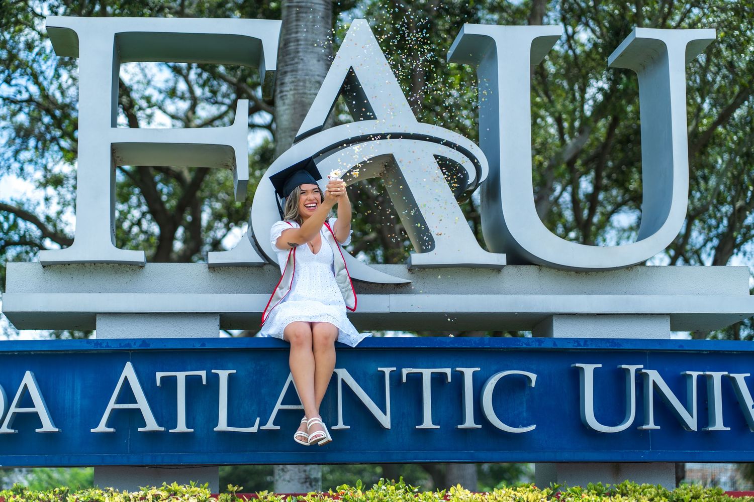 Large university signage spelling out 'Atlantic' mounted on exterior wall.