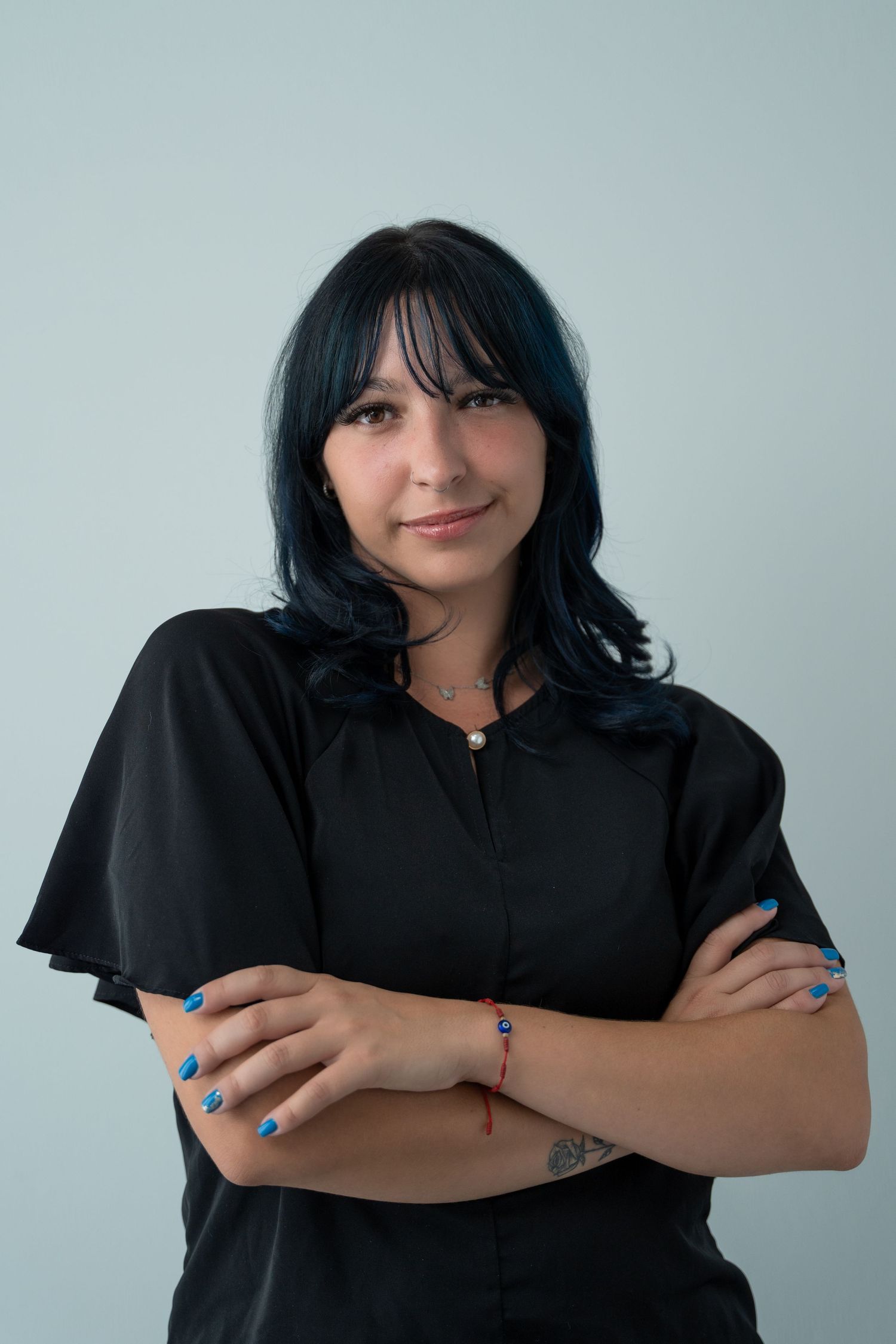 Creative entrepreneur headshot in Boca Raton, FL – stylish woman in a black blouse with a confident pose.