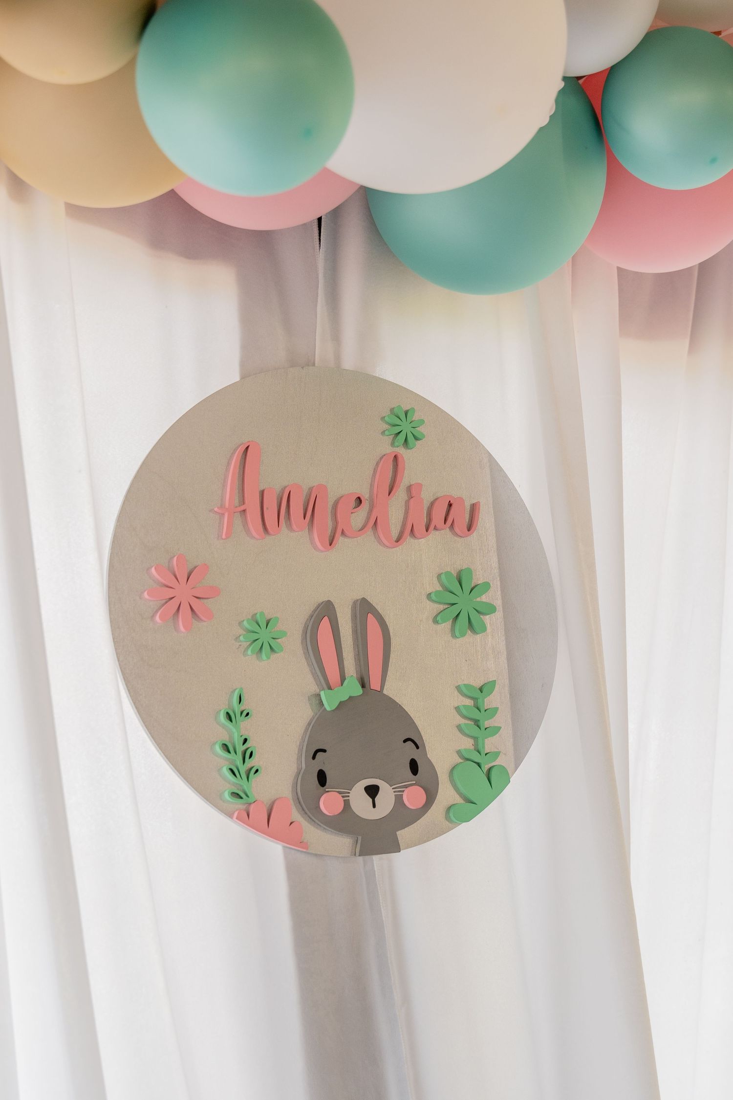 Close-up of a custom baby shower sign and balloon decor styled for a South Florida celebration.