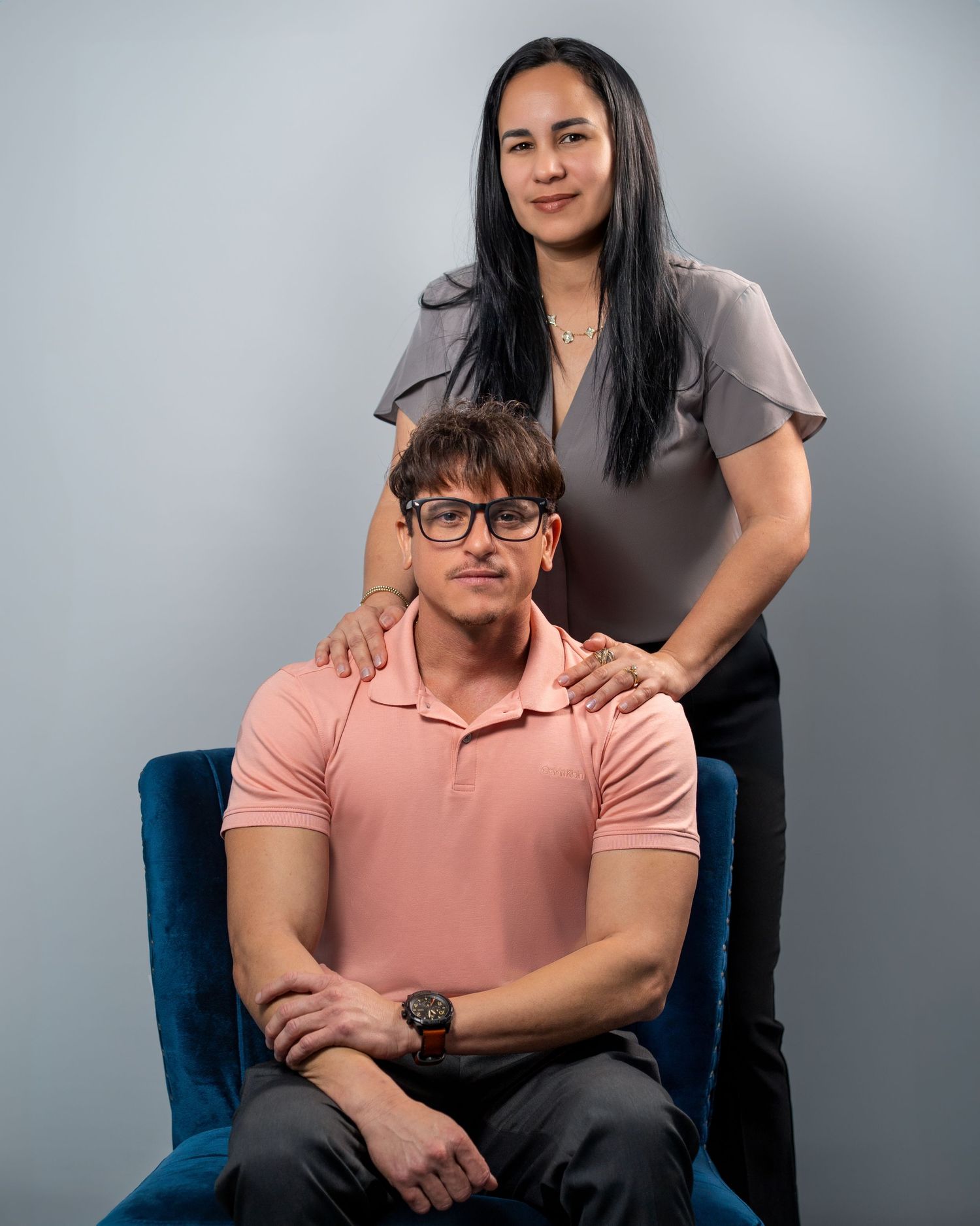 Insurance Agent duo posing for a formal studio portrait.