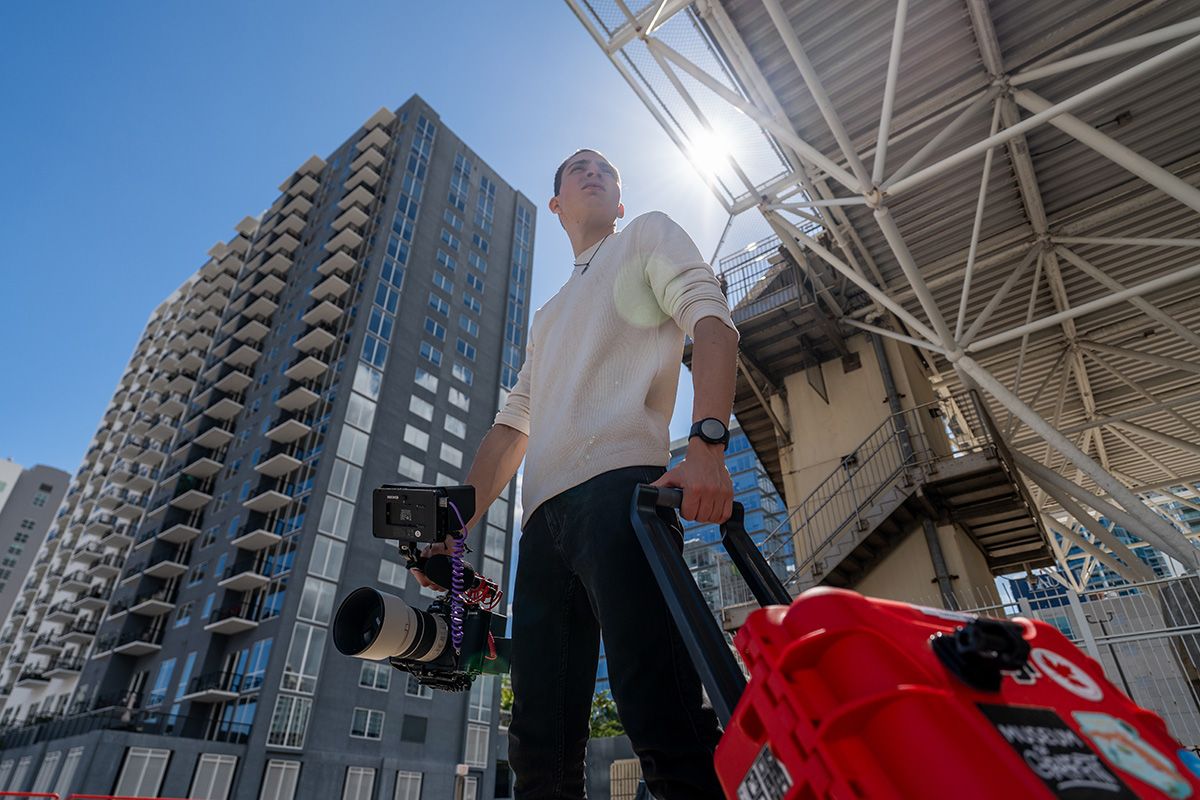 Entrepreneur walking with camera in downtown Miami during personal branding session