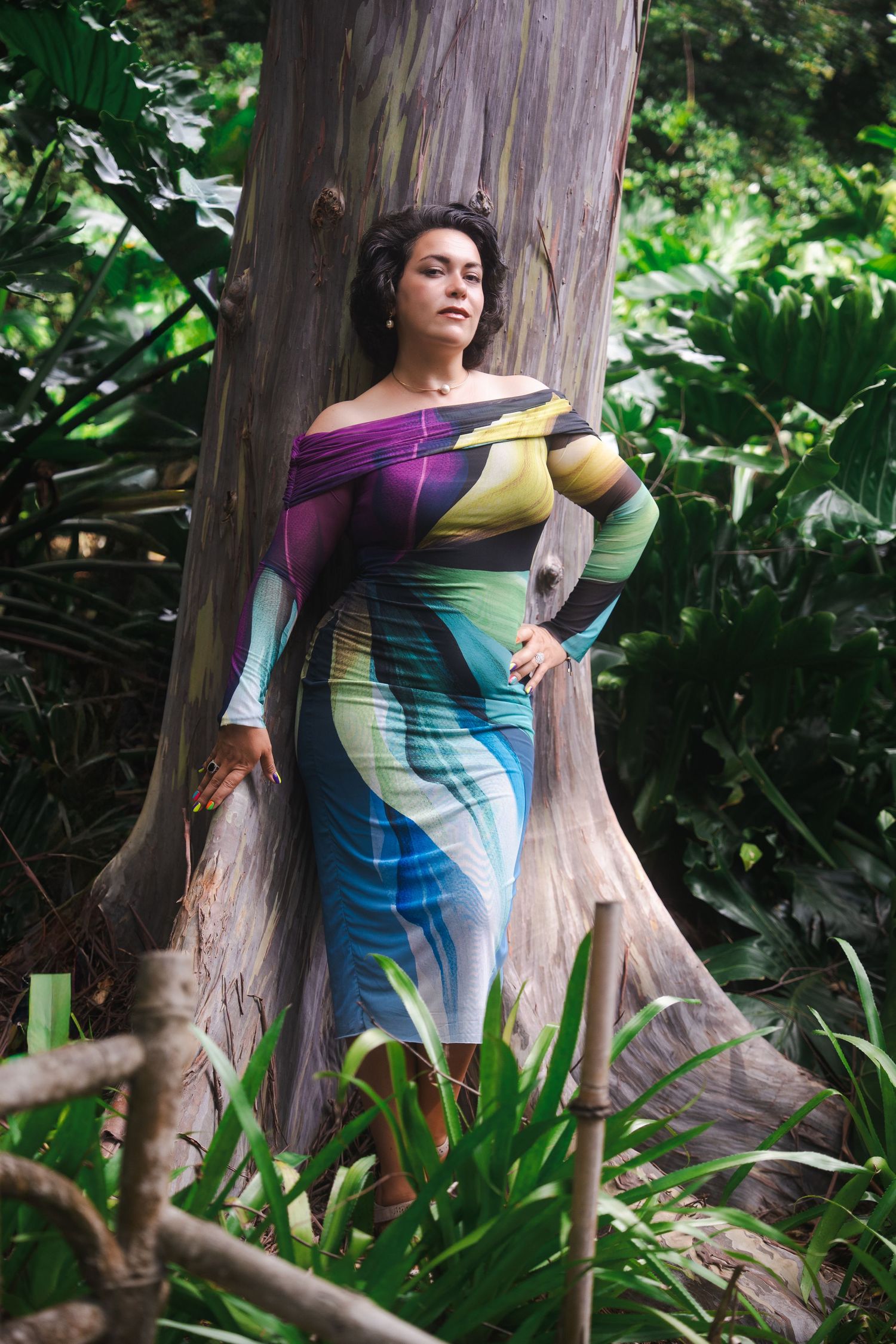 Lifestyle branding portrait of a woman standing against a large tree at Fairchild Tropical Botanic Garden in South Florida.