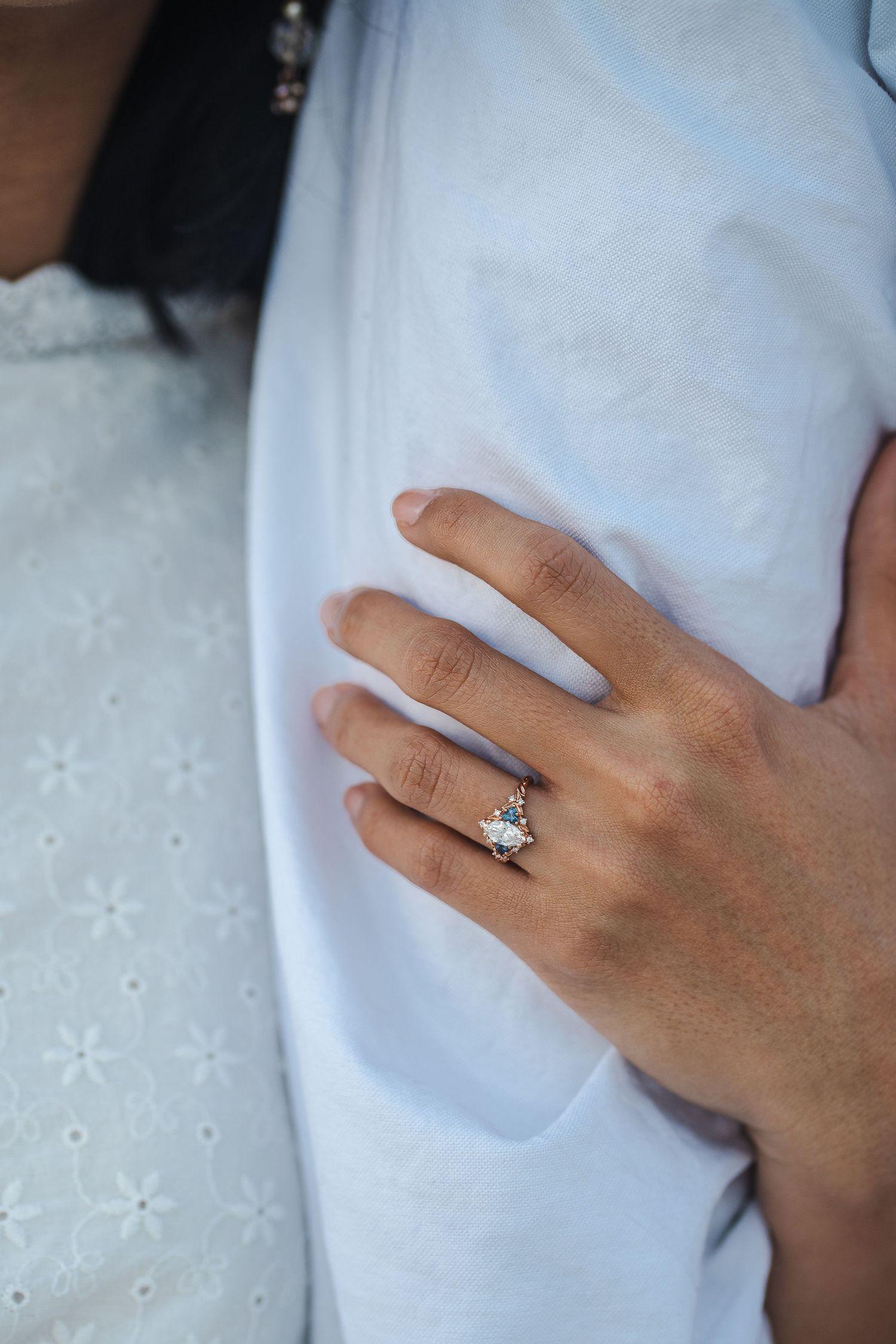 Close-up detail of engagement ring resting on partner’s arm during a Bill Baggs beach engagement session.