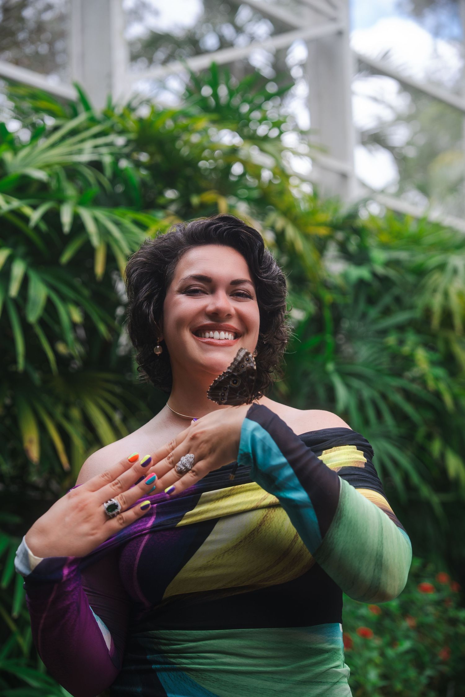 Lifestyle branding portrait of a woman smiling among tropical greenery at Fairchild Botanical Garden in South Florida.