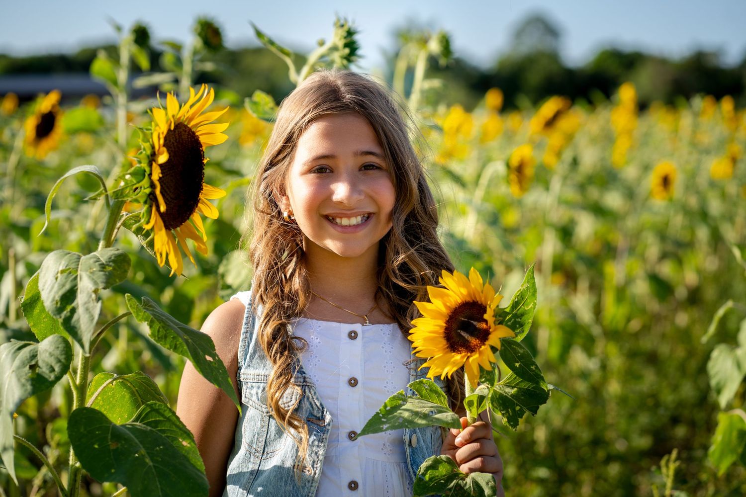 Solo birthday portrait in sunflower field at Berry Farms, Miami lifestyle photography.