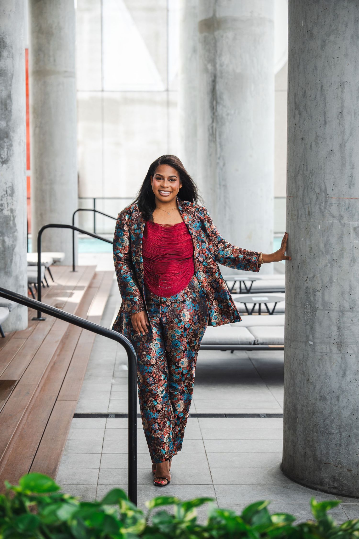 Entrepreneur branding photography of a scholarship coach walking through an urban setting in South Florida.