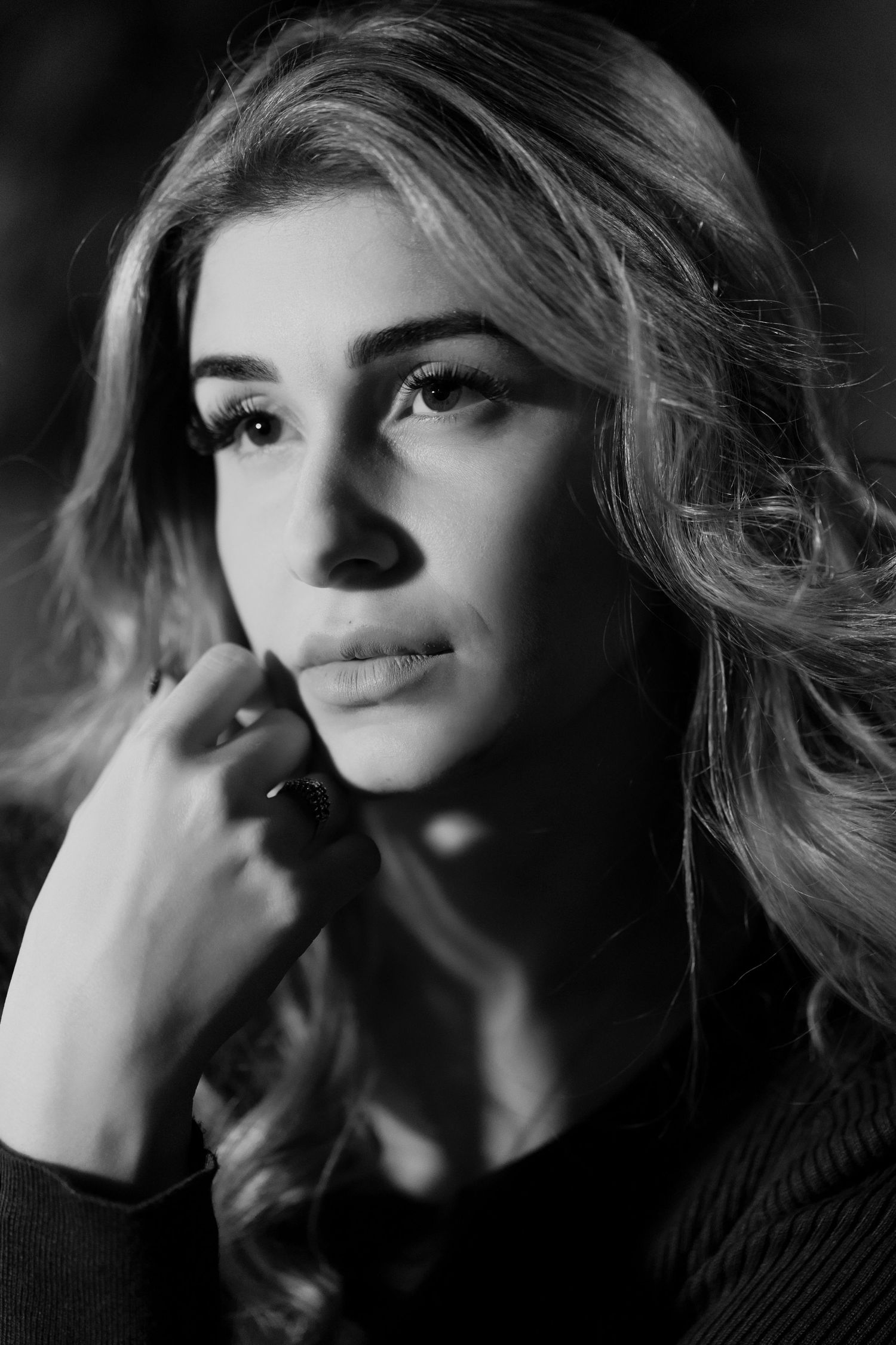 Black and white portrait by South Florida photographer, editorial close-up with soft light and timeless expression