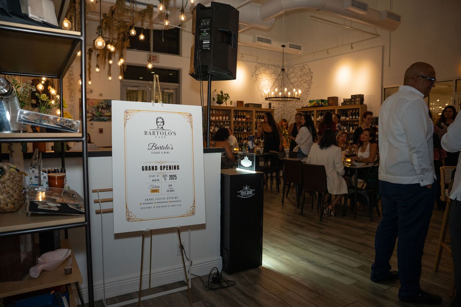 Interior scene showing event signage and guests mingling during a social gathering.
Event photography in South Florida