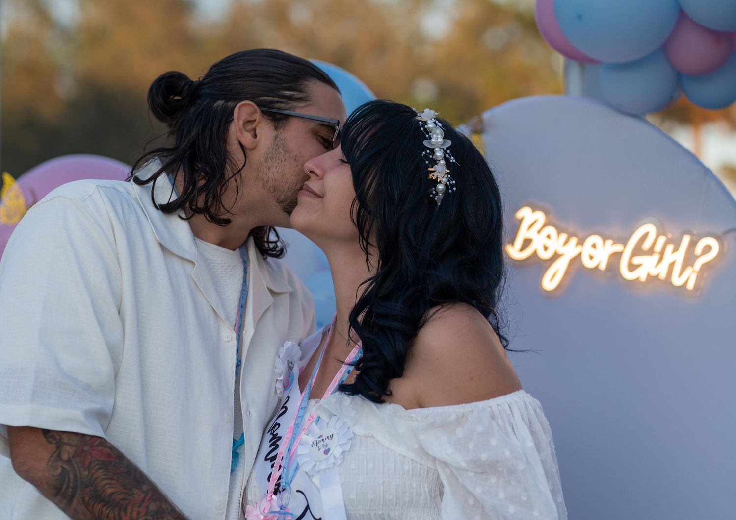 Close-up of expecting couple sharing an emotional moment during a South Florida gender reveal celebration.