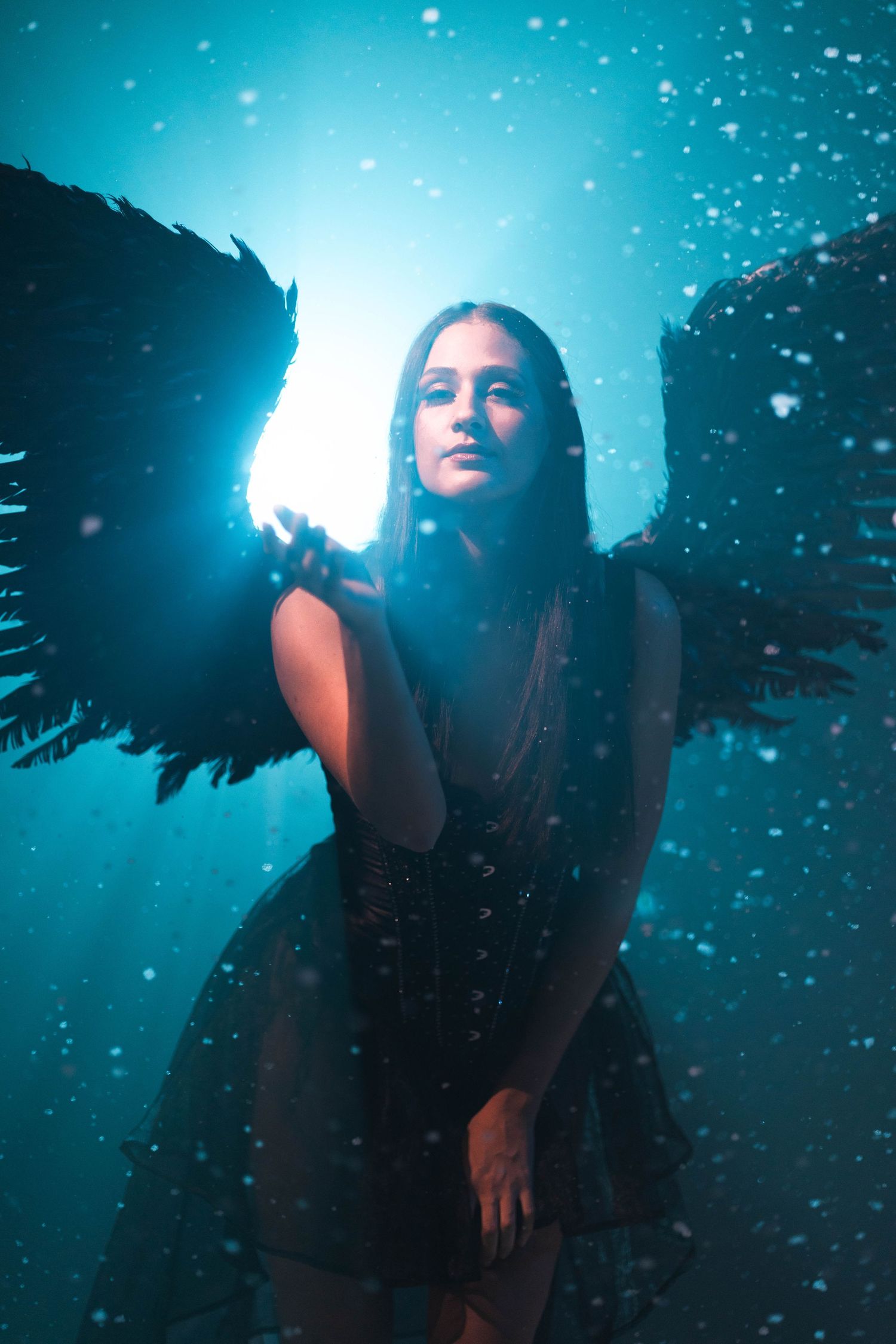 Dark angel editorial shoot at CFX Studio, Miami, FL – mystical and moody high-fashion concept with black wings.