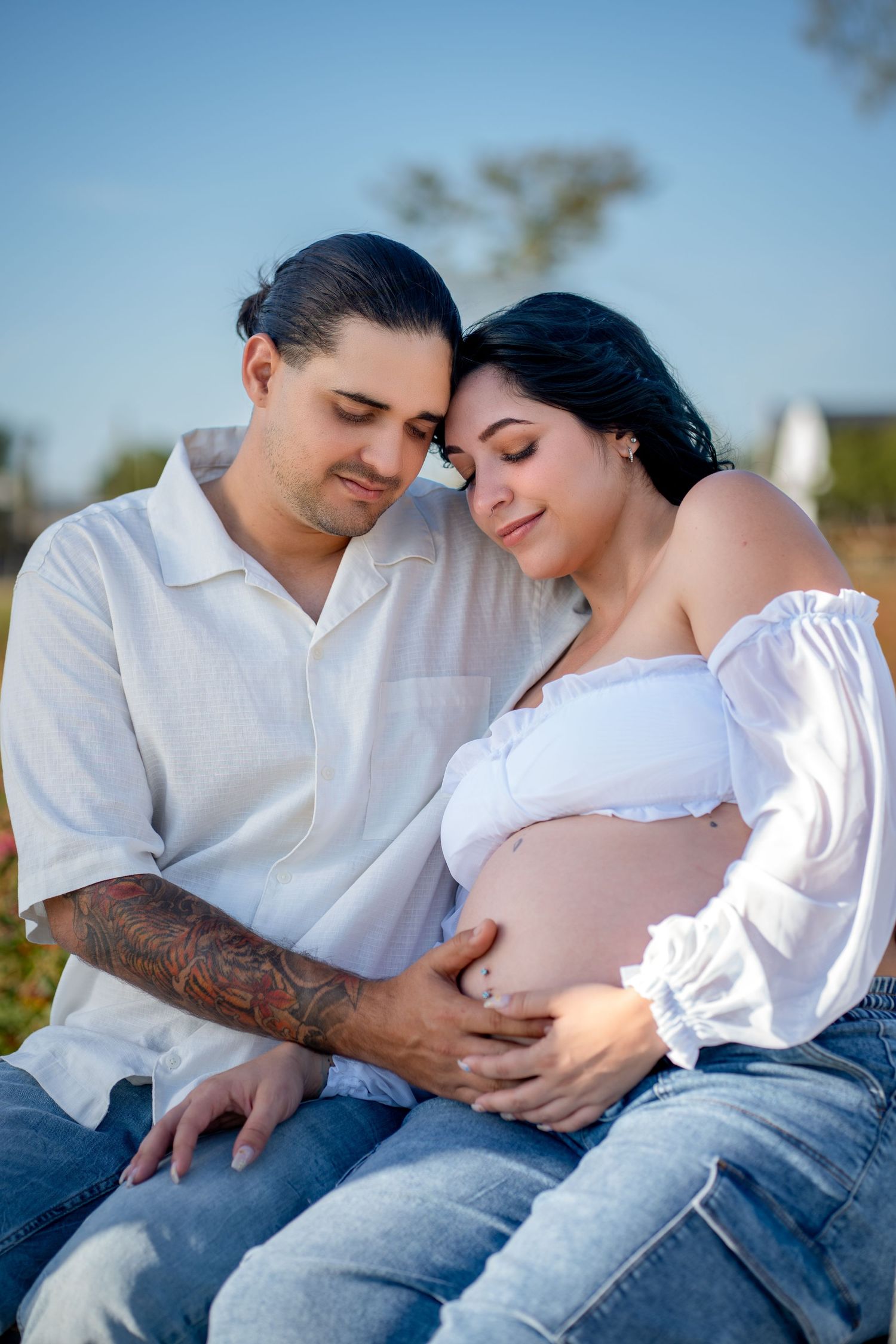 Family maternity session at Berry Farms in golden natural light.