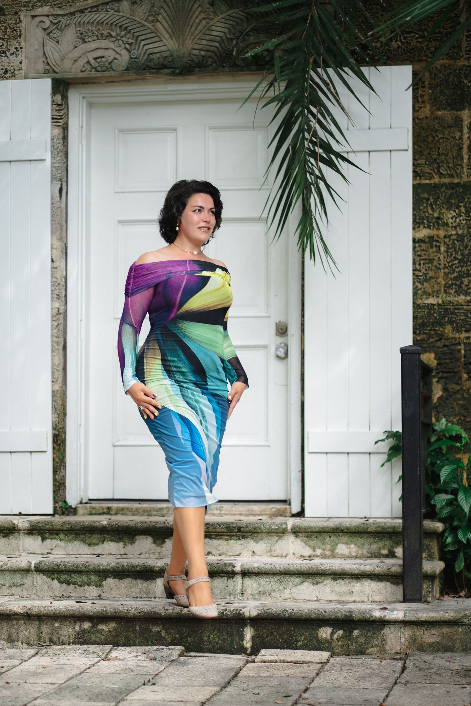 Woman posing in colorful outfit during branding session at Fairchild Tropical Garden in Miami