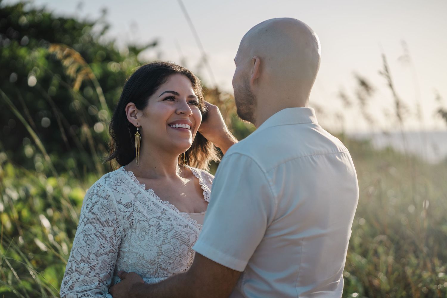 Couple sharing a moment during maternity shoot at Dania Beach, South Florida