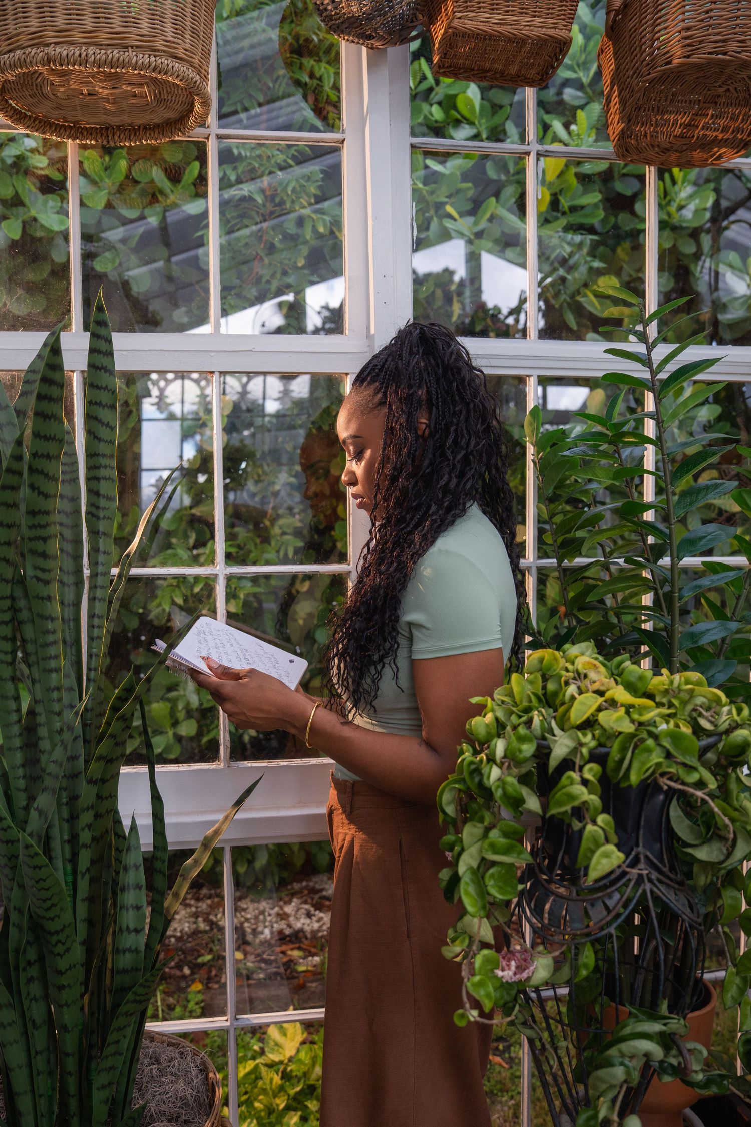 Fort Lauderdale branding headshot of woman writing in journal among plants 
Miami Photographer