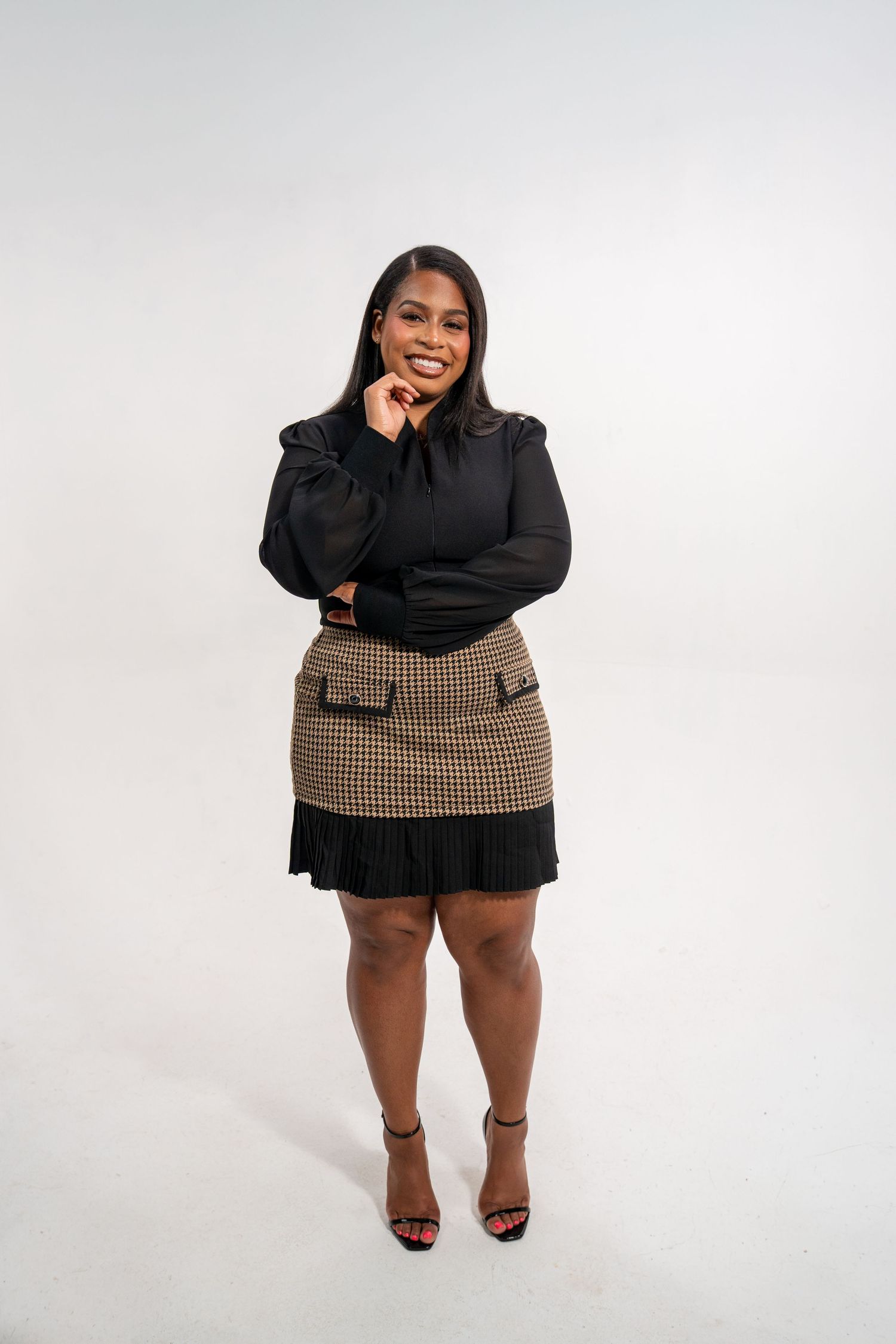 Entrepreneur branding portrait of a scholarship coach posing confidently in a minimalist studio setting.