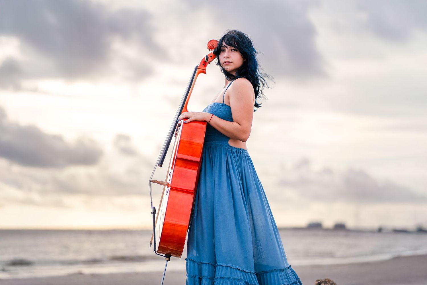 Cellist posing on South Florida beach during personal branding session