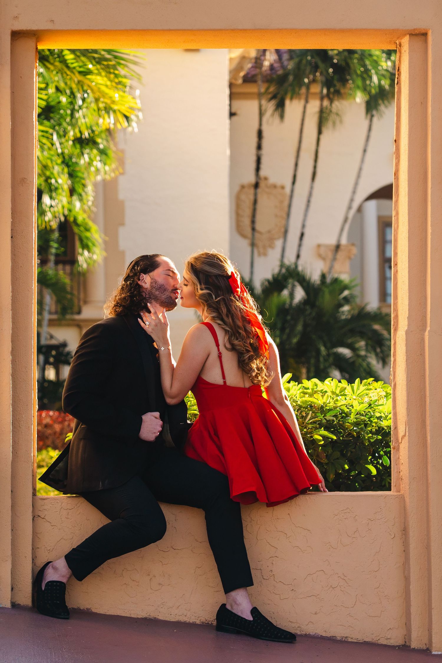 Intimate proposal scene captured through a guided photography experience with couple sharing a kiss in South Florida