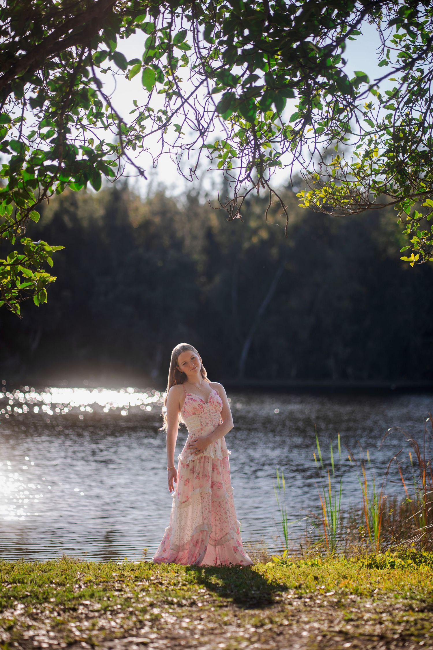 Senior portraits in South Florida by photographer, outdoor session by the water with soft light and natural scenery