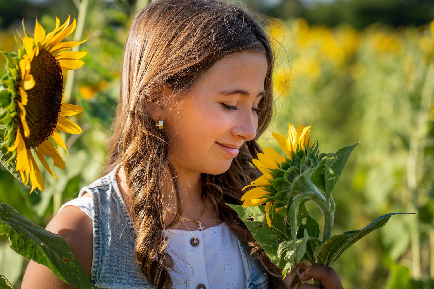 Candid sunflower moment during a birthday photo session at Berry Farms.