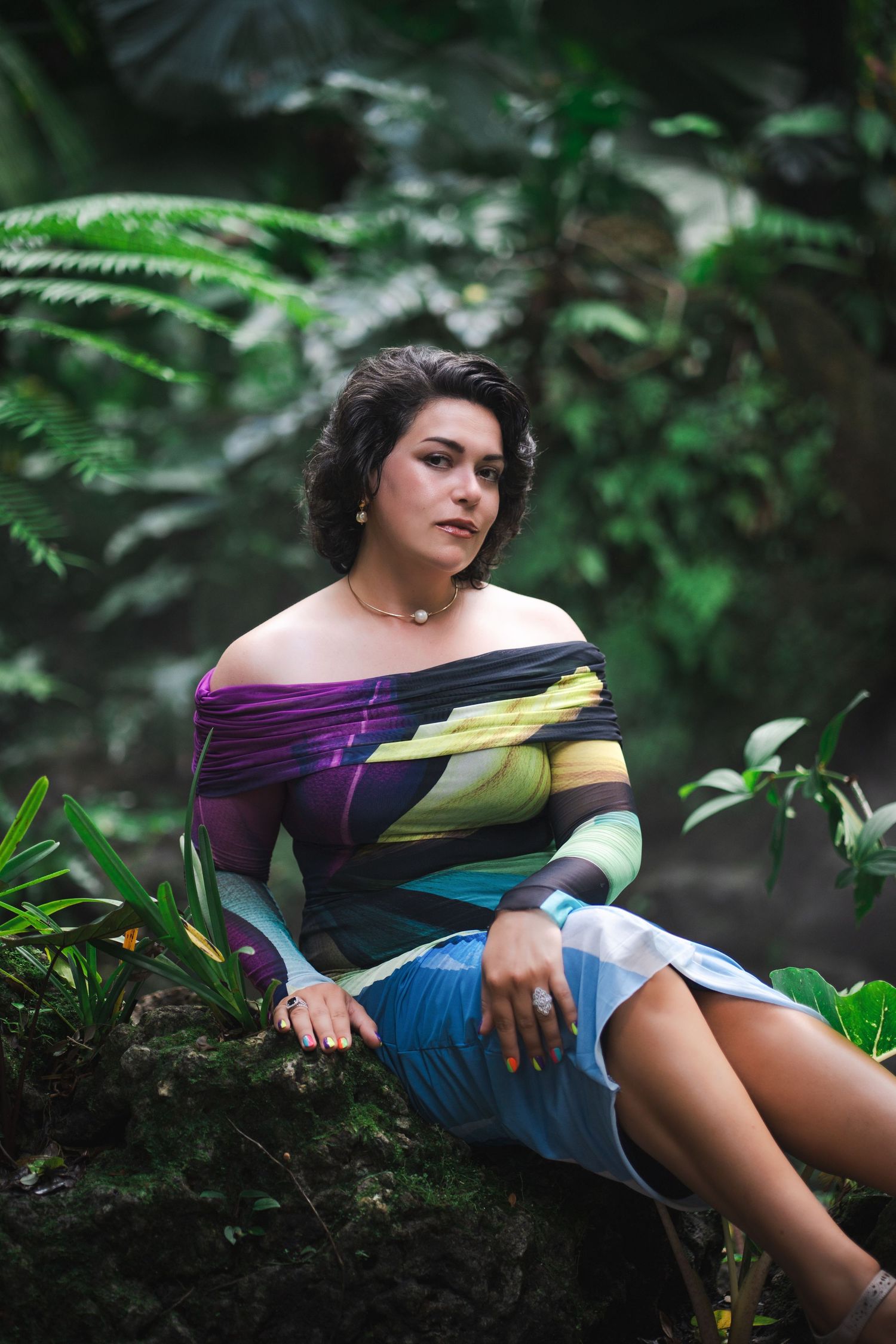 Lifestyle branding portrait of a woman seated among lush greenery at Fairchild Tropical Botanic Garden in South Florida.