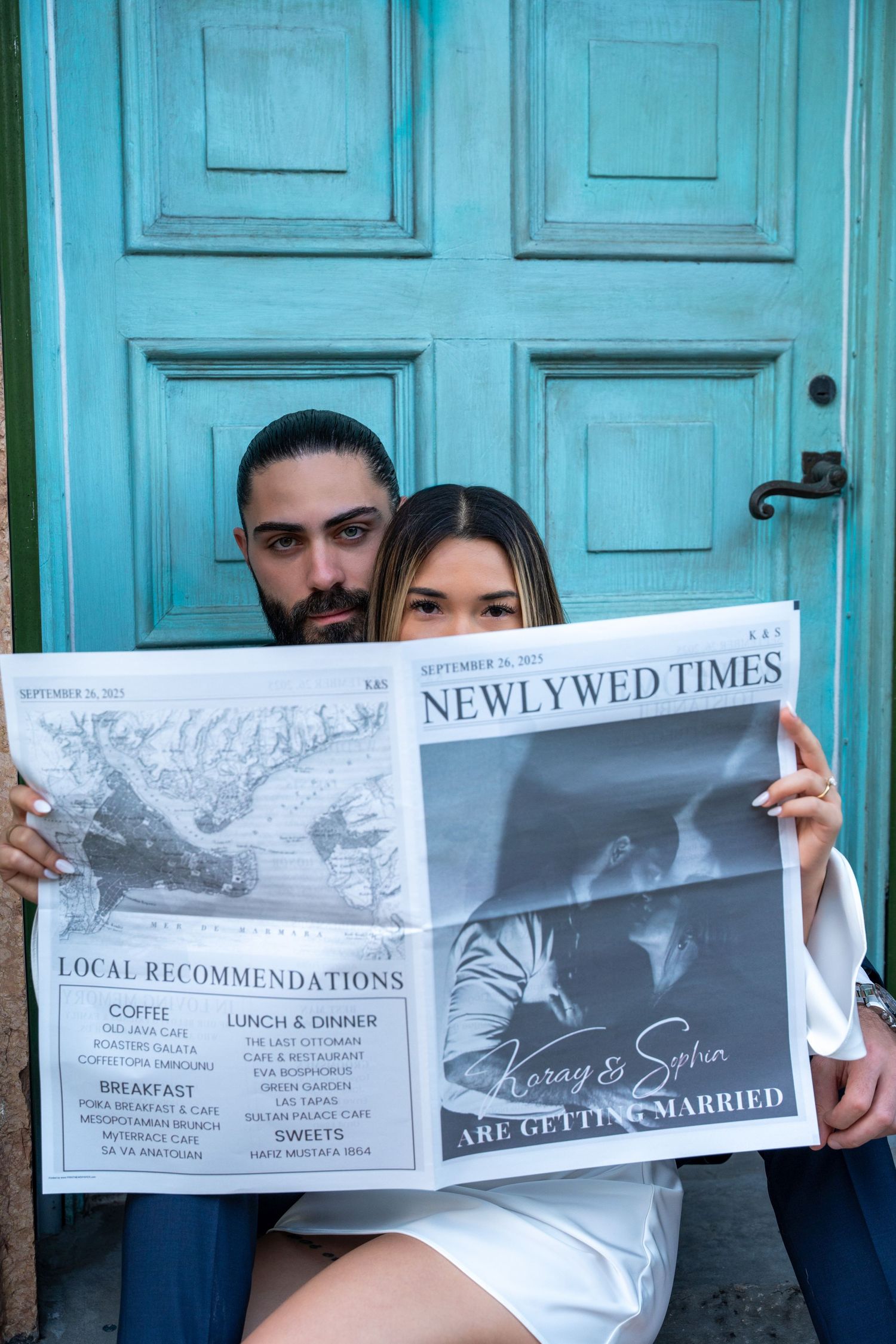 Creative engagement session in Palm Beach, featuring a couple playfully posing with a vintage newspaper in a colorful, historic setting.