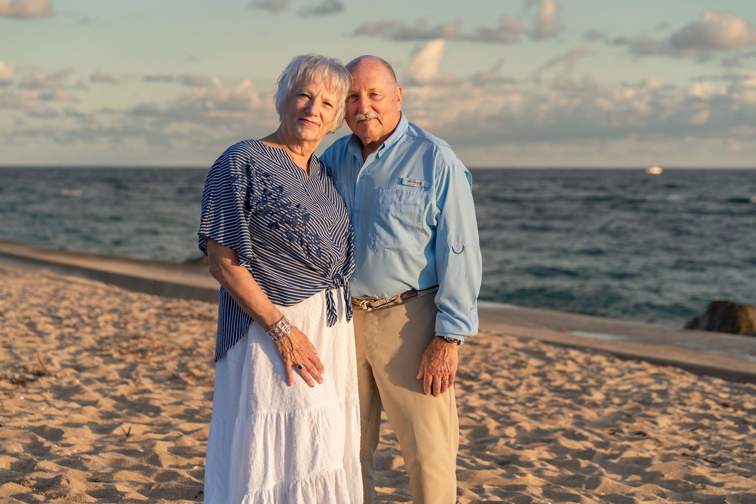Senior couple portrait in Palm Beach, FL – warm sunset moment captured by the ocean, celebrating lasting love.