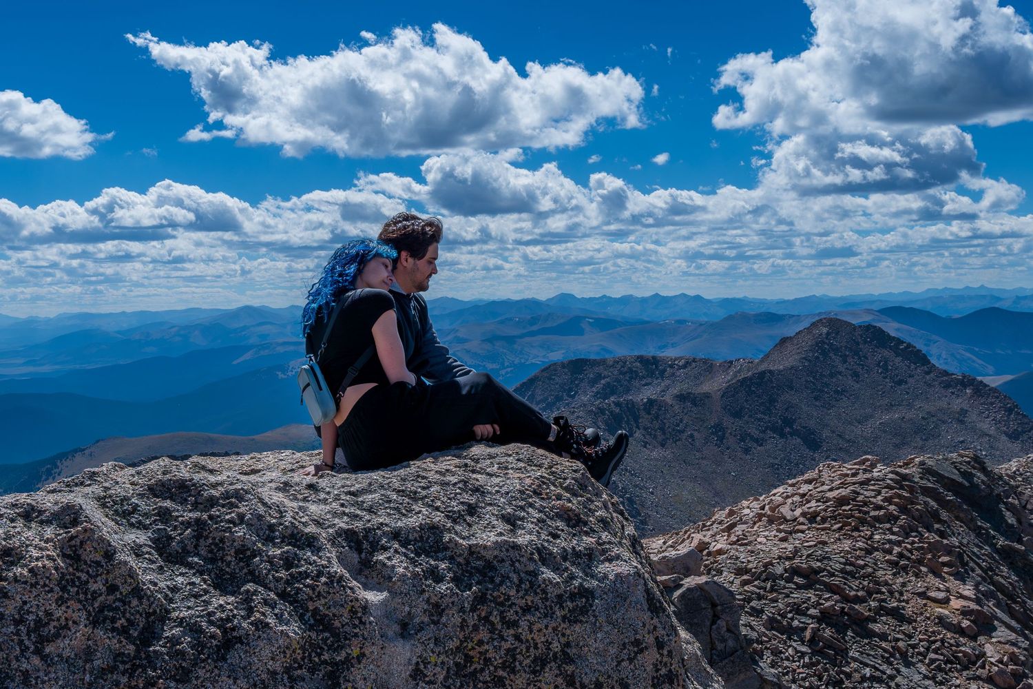 Adventurous couples session at Mount Evans, Colorado, capturing love and exploration with a stunning mountain landscape.