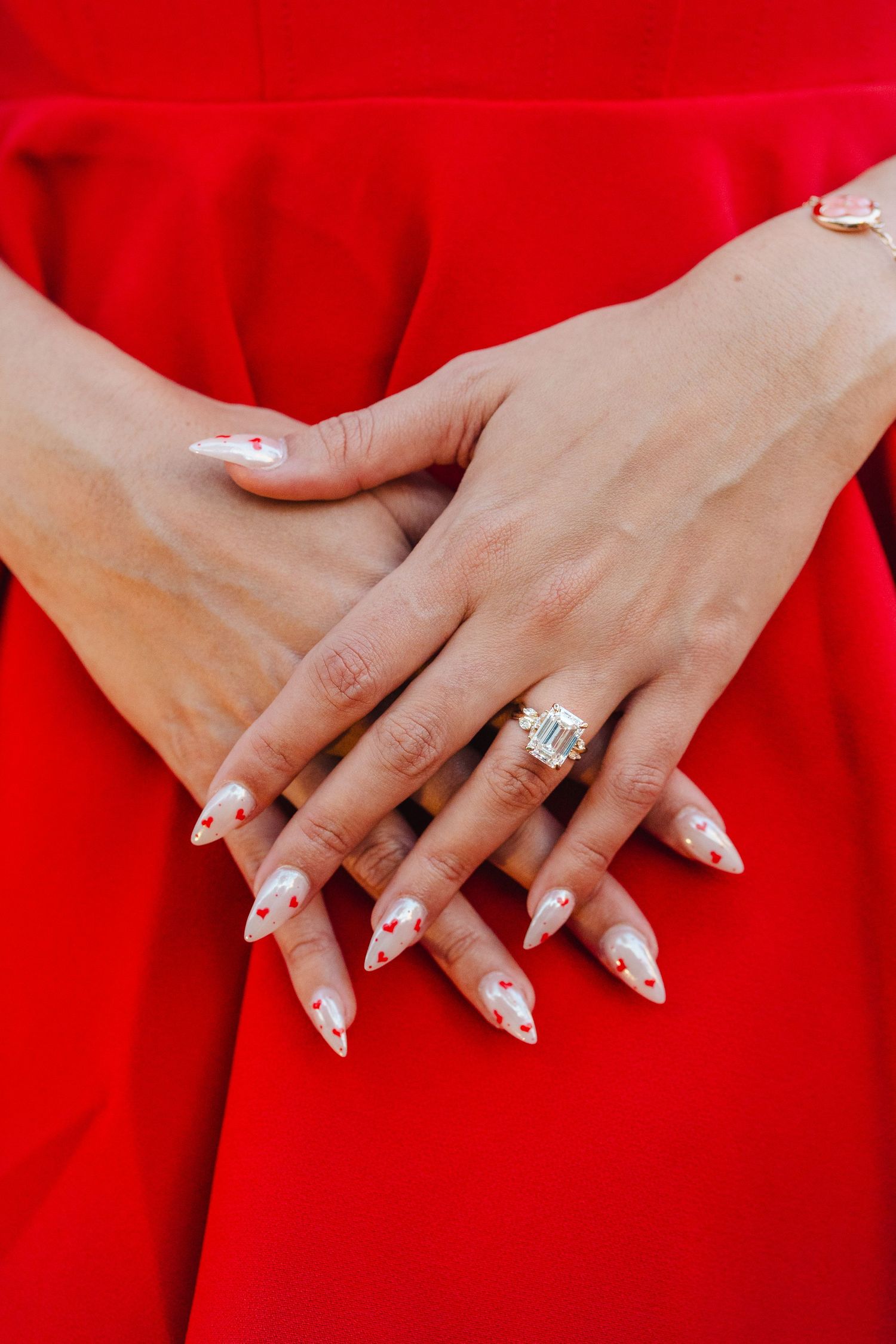 Close-up engagement ring detail captured during a guided proposal photography experience with soft, editorial styling