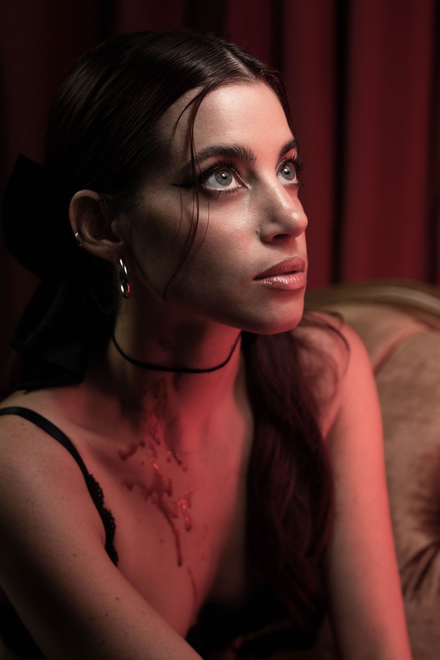 Editorial portrait in South Florida by photographer, woman with cinematic lighting and rich tones for creative portrait session