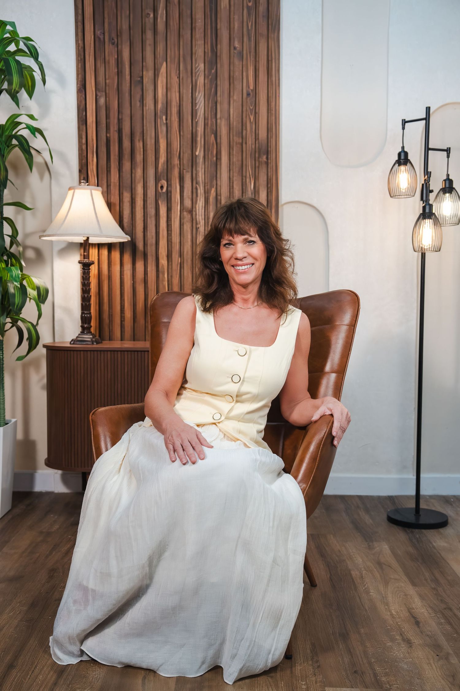Female realtor seated in office during personal branding photo session in South Florida