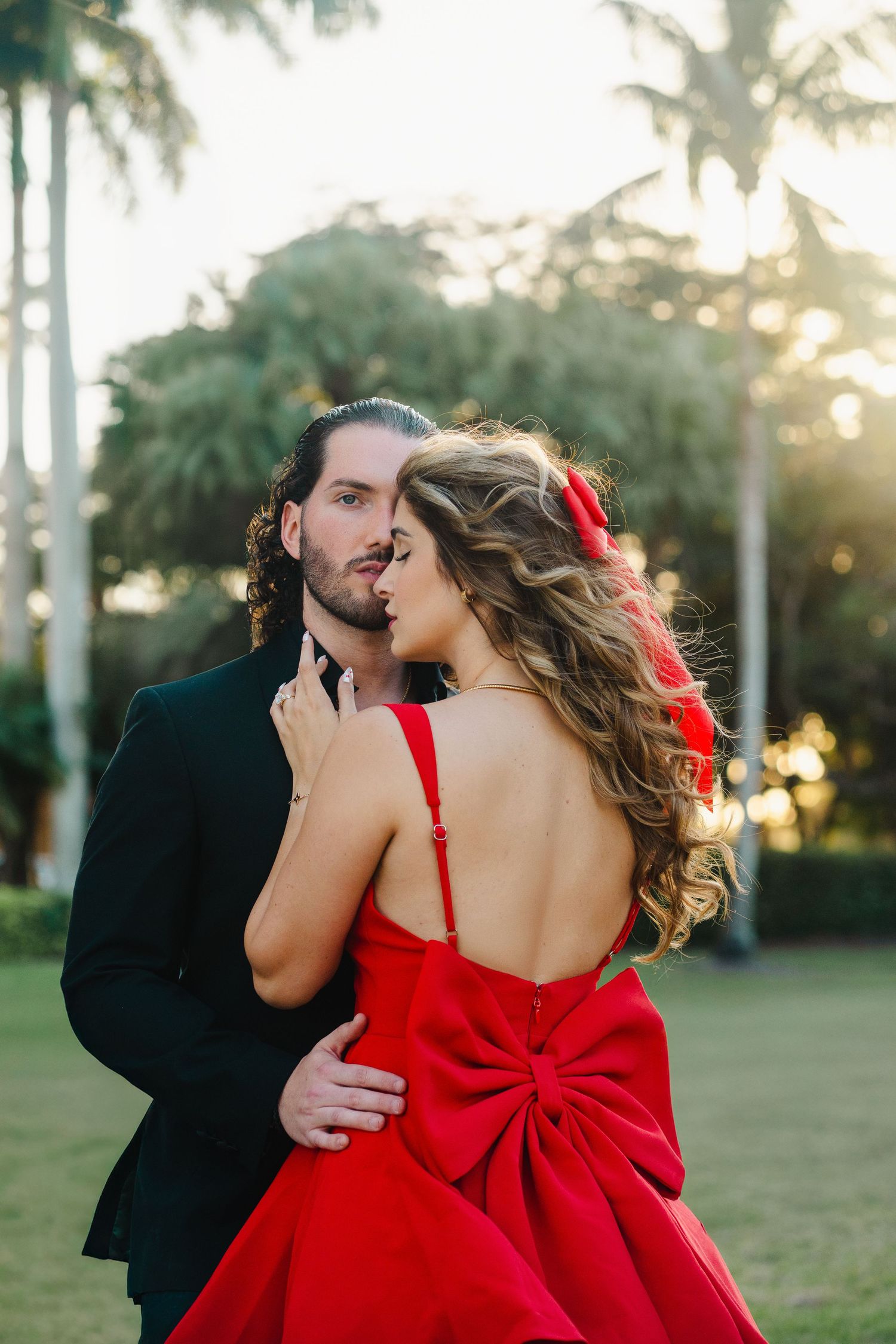 Romantic proposal portrait in South Florida captured through a guided photography experience with couple embracing at sunset