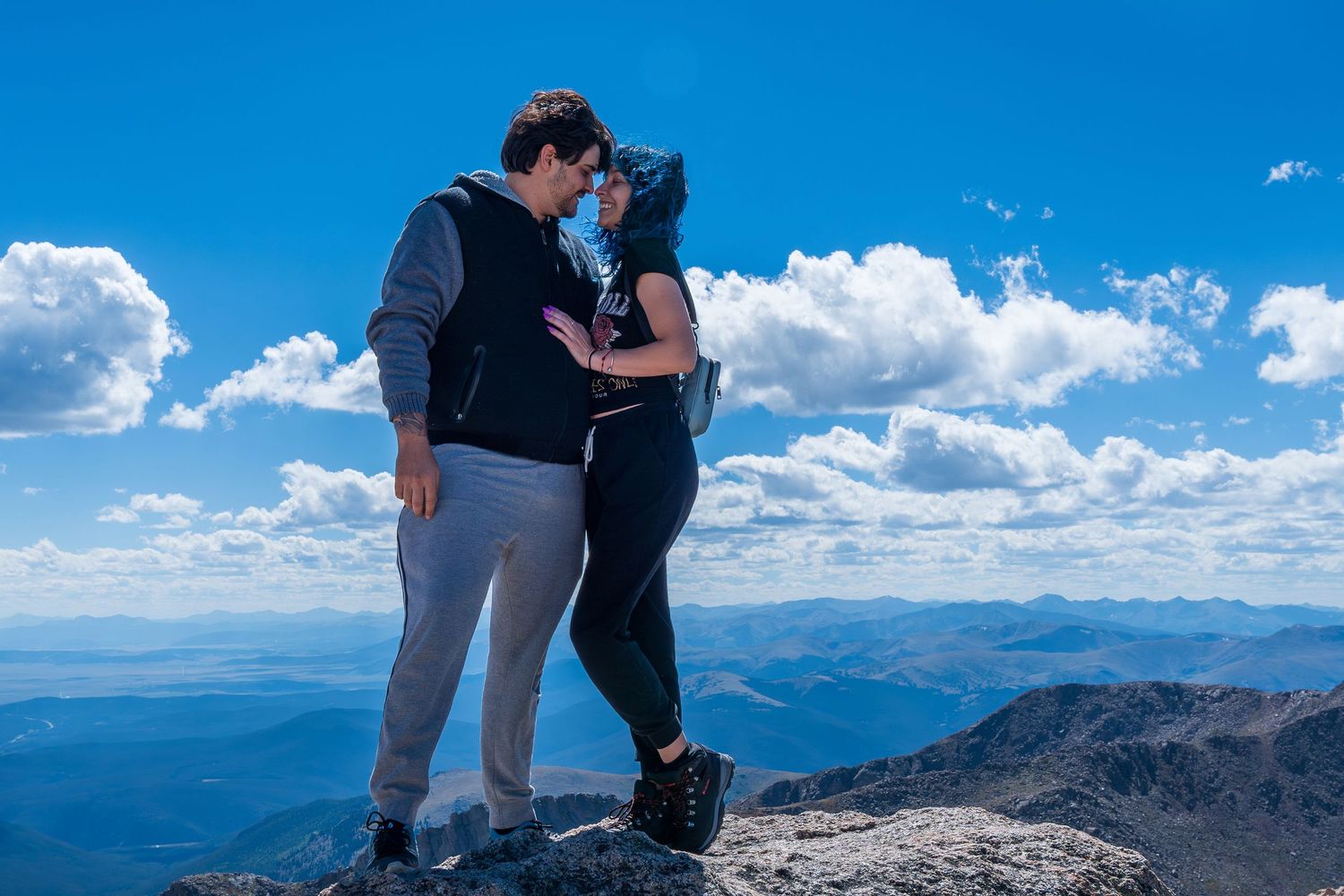 Adventurous couples session at Mount Evans, Colorado, capturing love and exploration at a high-altitude scenic overlook.