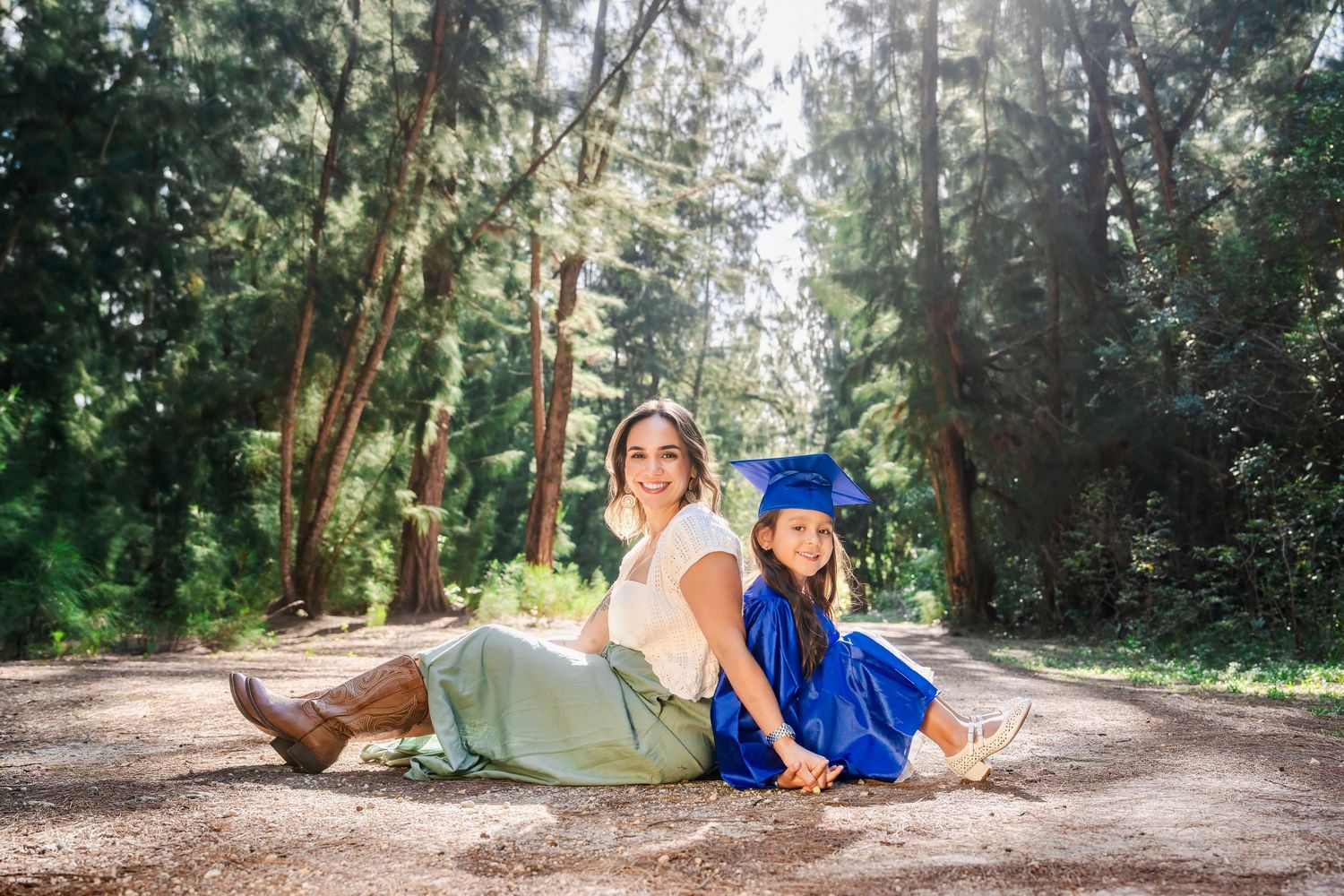 Kindergarten graduation portraits at Tree Tops Park in Davie by South Florida photographer, child with mom outdoors