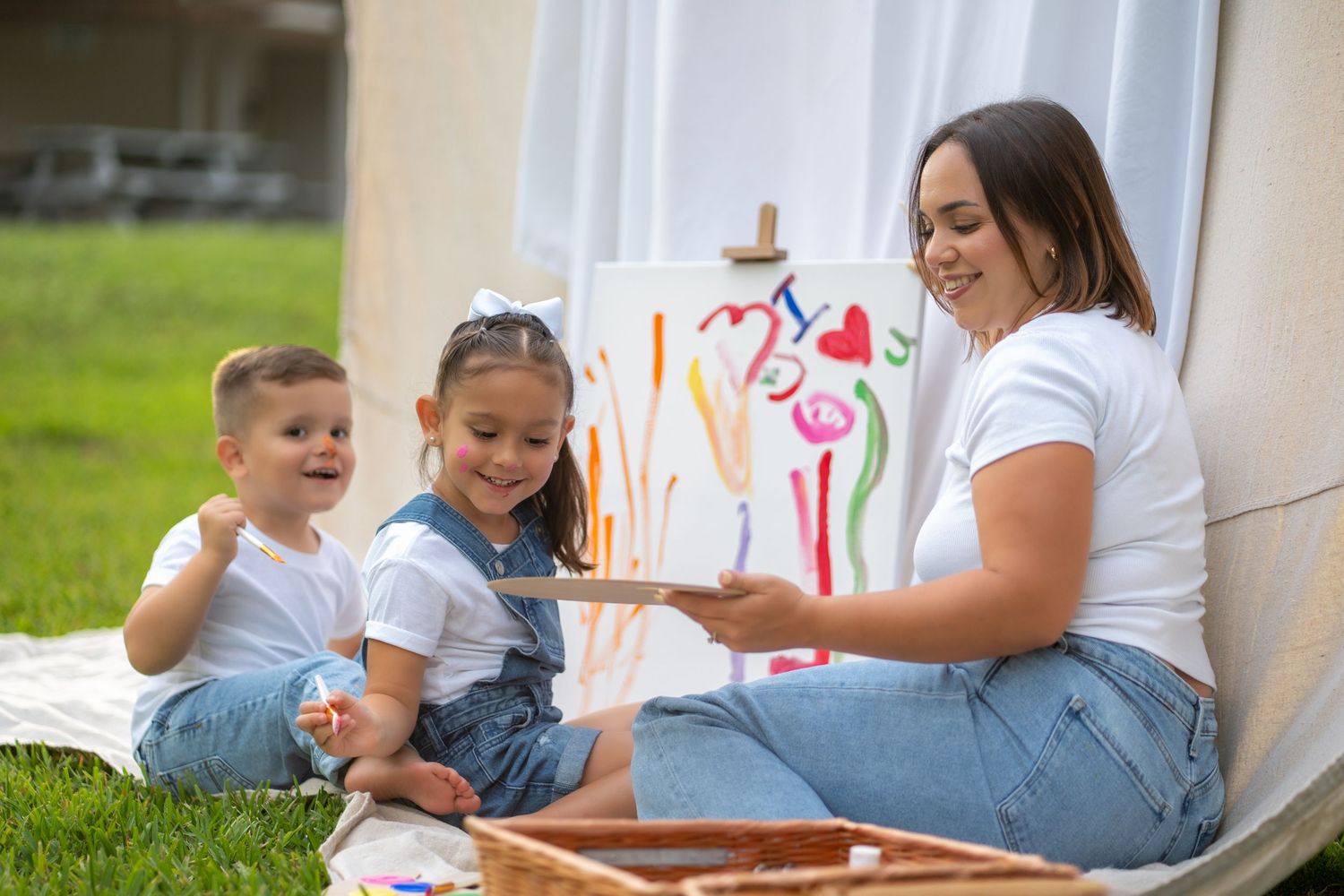 Mom and kids enjoying creative time together during a candid family photo shoot in Broward County.