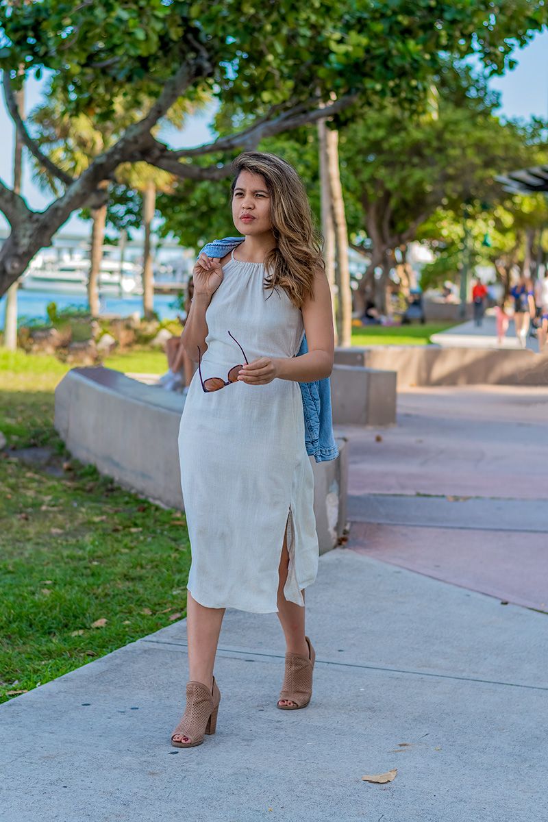 Chic lifestyle photoshoot in South Pointe Park, Miami Beach, FL – stylish woman strolling along the waterfront.