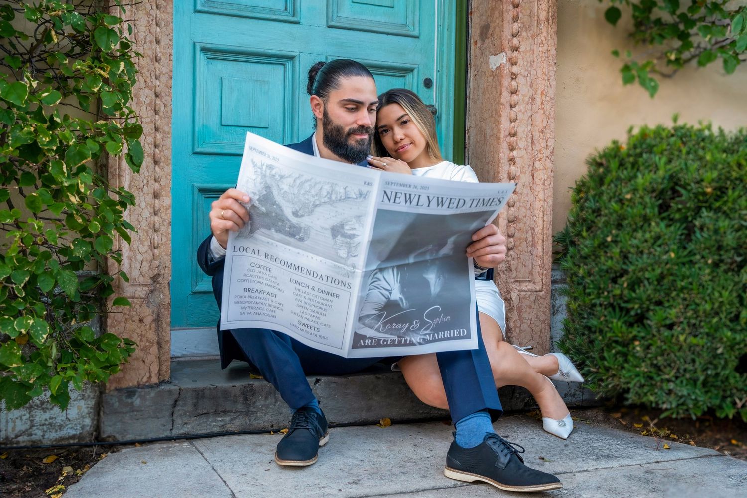 Creative engagement session in Palm Beach, capturing a couple sharing a playful moment with a vintage newspaper backdrop.