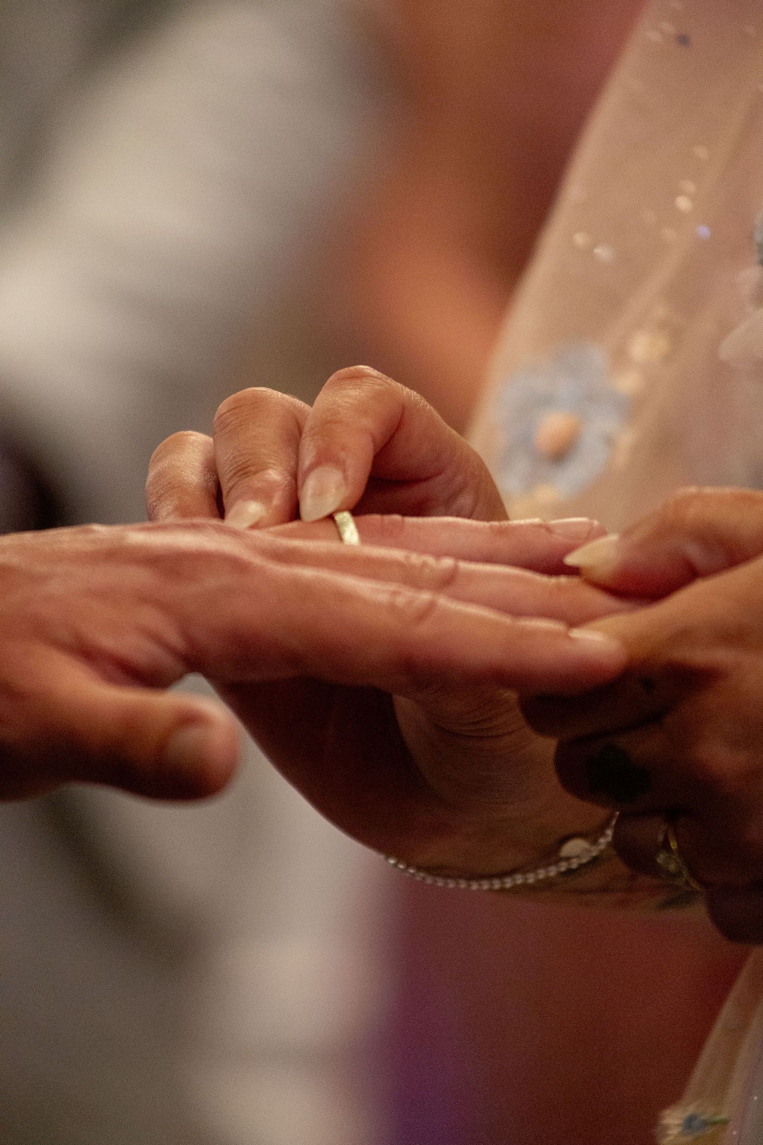 Close-up sequence showing hands holding and examining small pieces of food or ingredients.