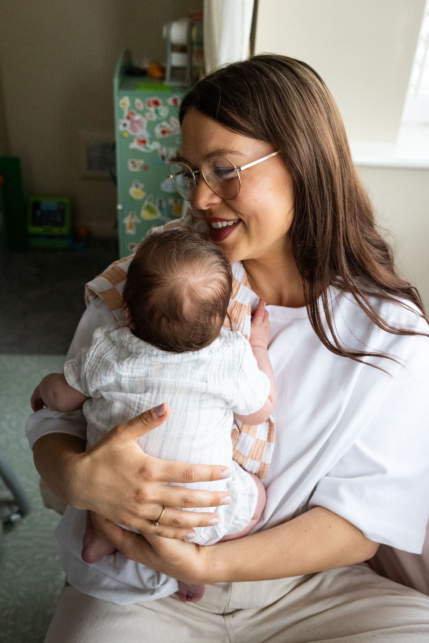 Family photograph of Mother and baby having moment of connection during an at home session in Lincoln, UK