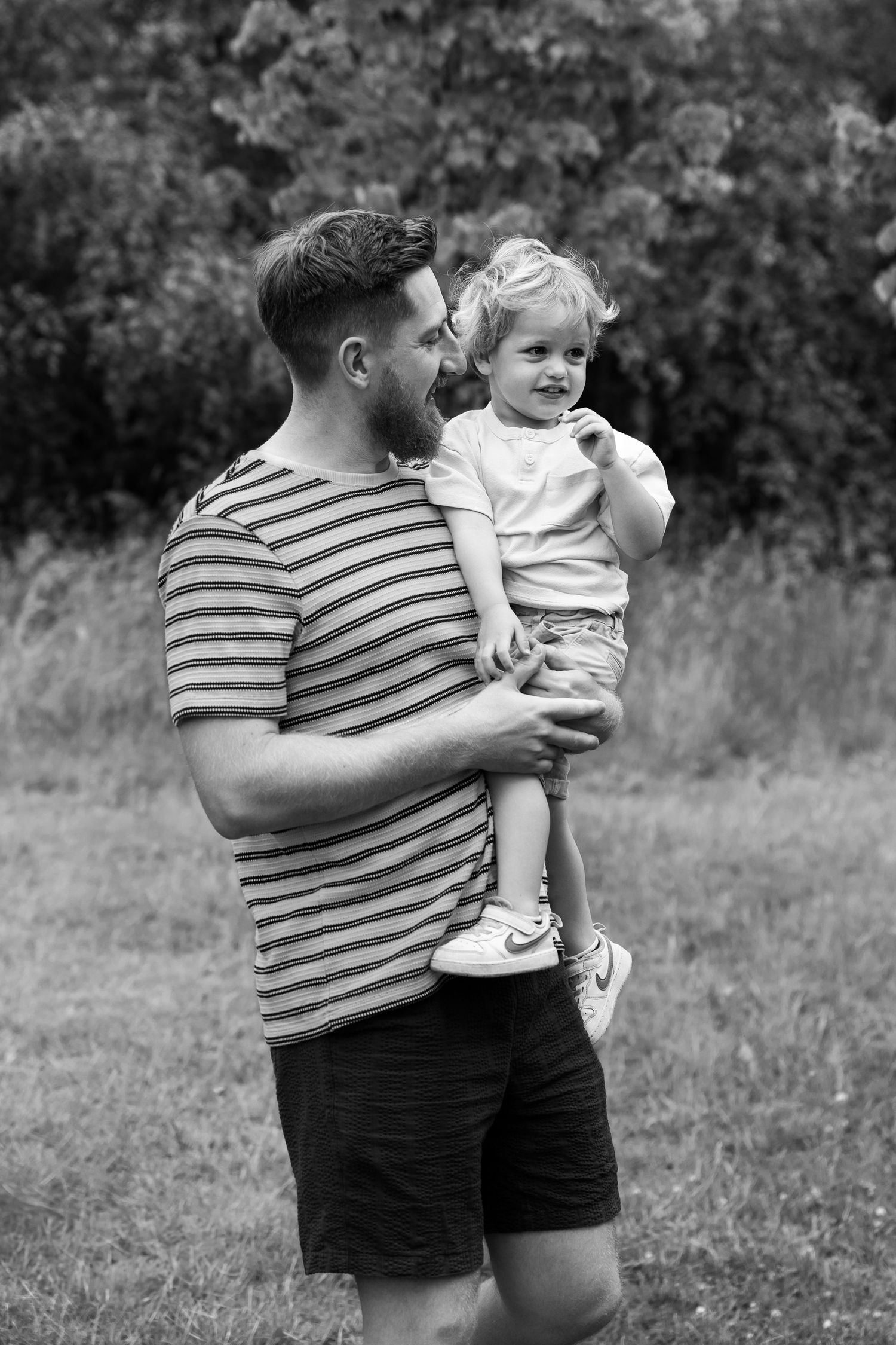 Father and son in family photography session in a rural nature filled location in Lincoln, Lincolnshire.