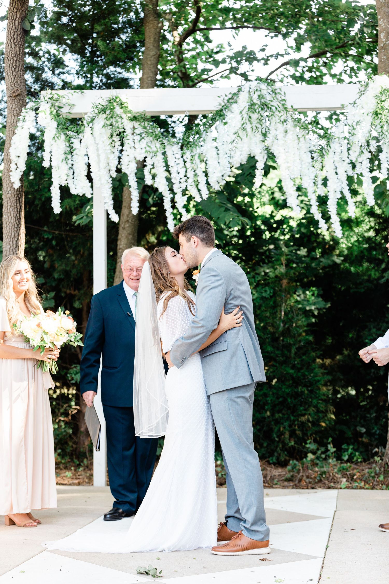 First kiss of the bride and groom after they said their I dos at the front of the alter.