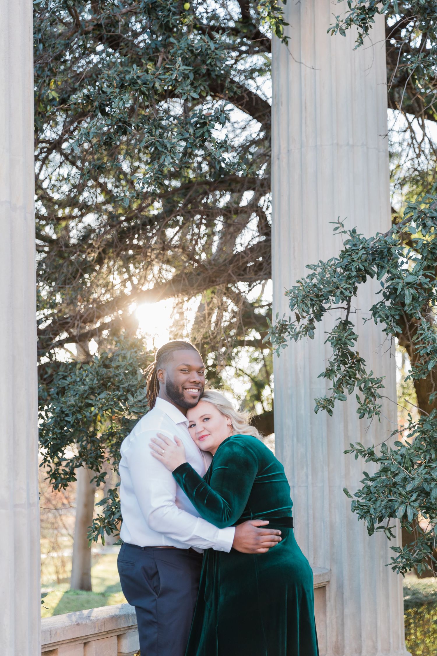 Sun flare engagement photo at Texas Women's university.