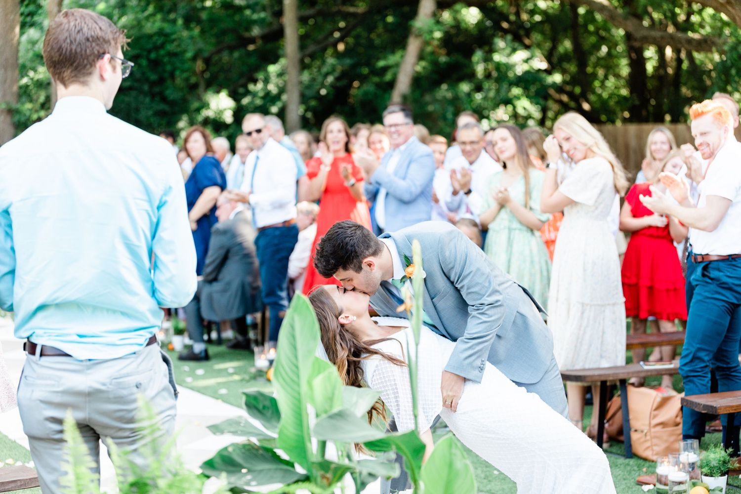 First kiss of the bride and groom after they said their I dos while walking in the recessional.