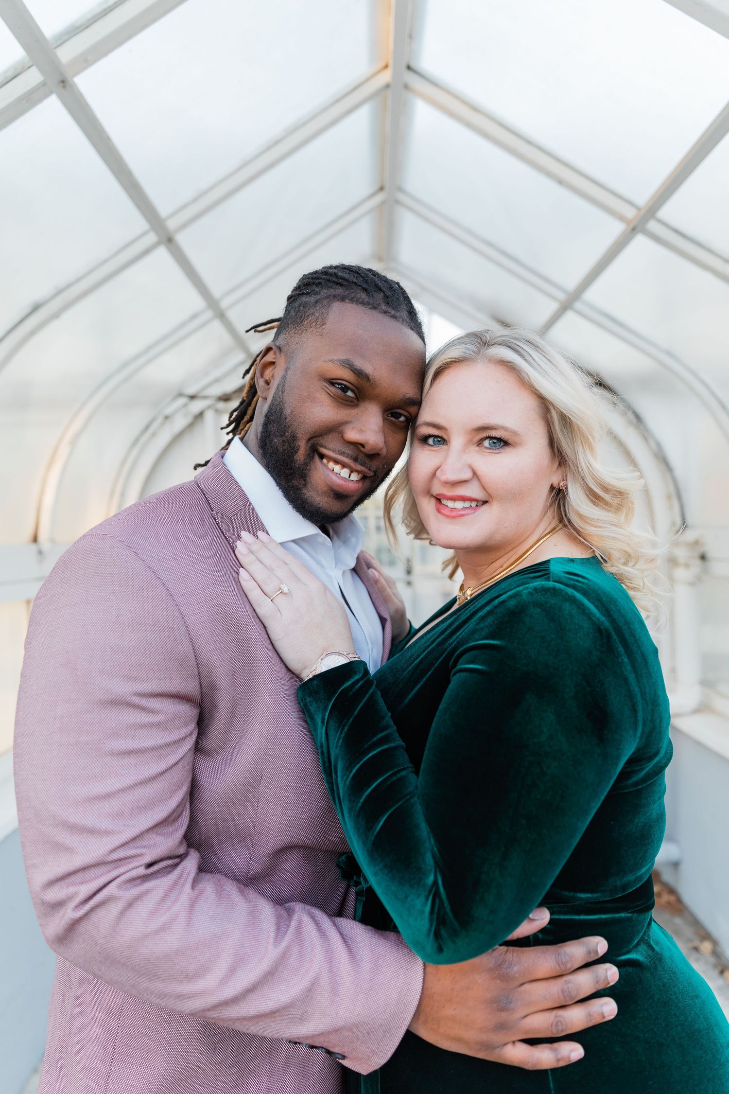 Bride and groom touching their temples together for an up close and personal engagement photo at Texas Women's University.