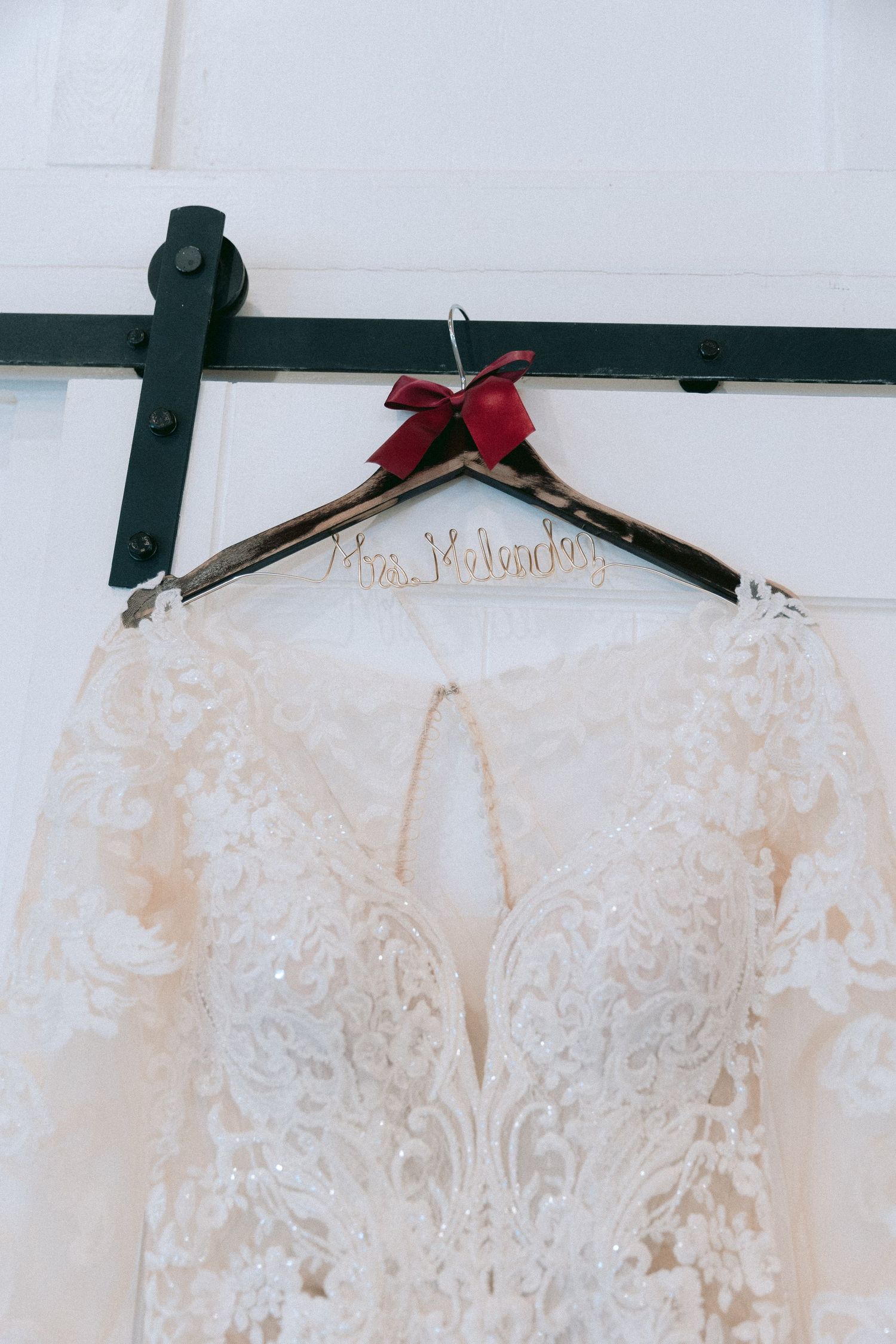 Detail shot of the dress and the custom bride hanger.