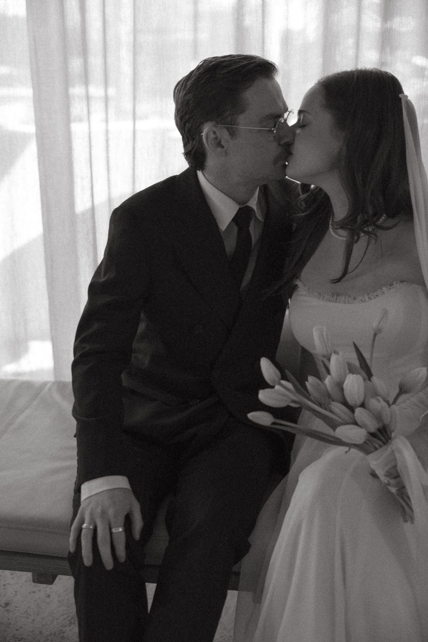 A romantic black and white photo sequence shows a couple sharing tender moments together.