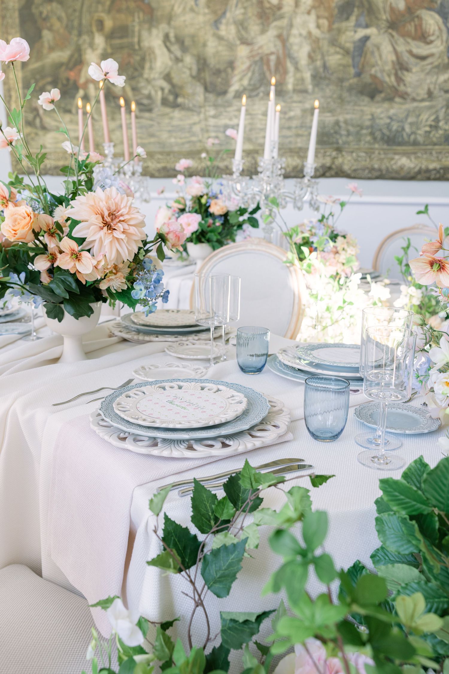 elegant floral wedding tablescape with pastel flowers, vintage plates and crystal glassware - captured by Miriam Caterina Wahl