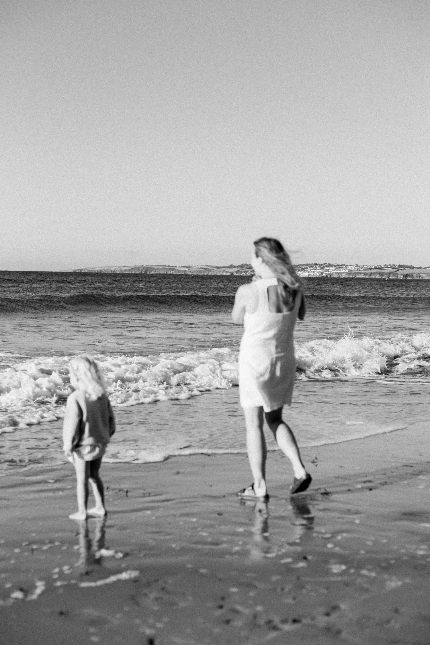 mother and children looking out into the sea