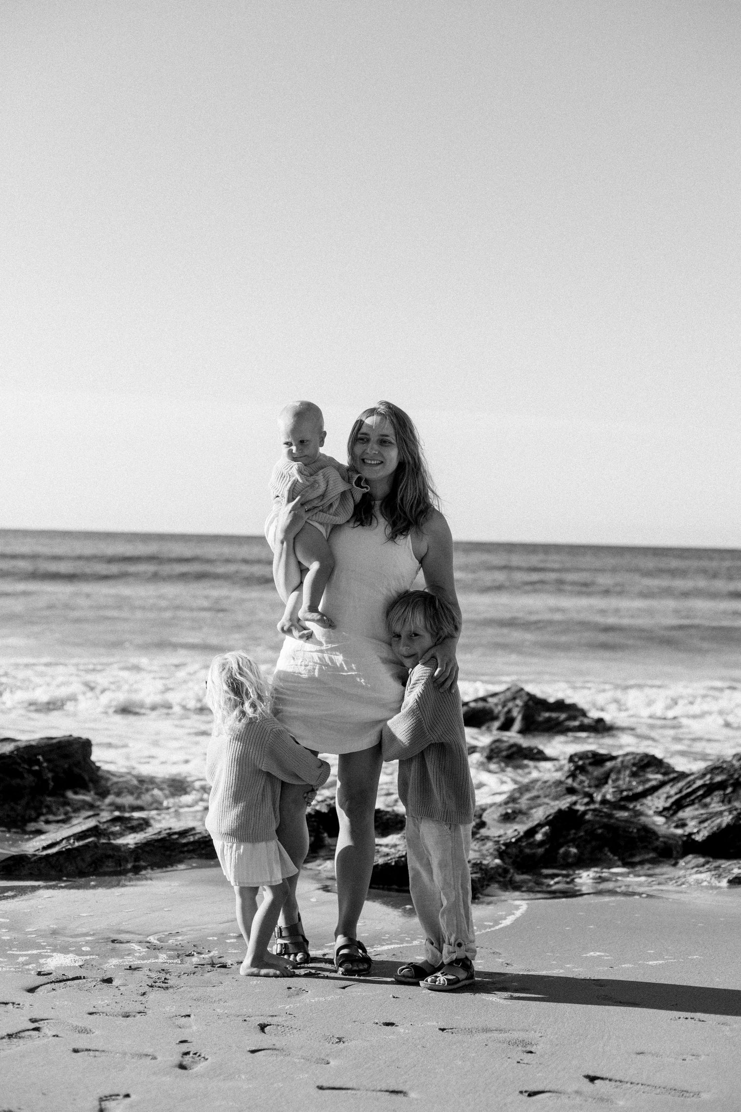 M C Wahl and her three children at the beach in cornwall