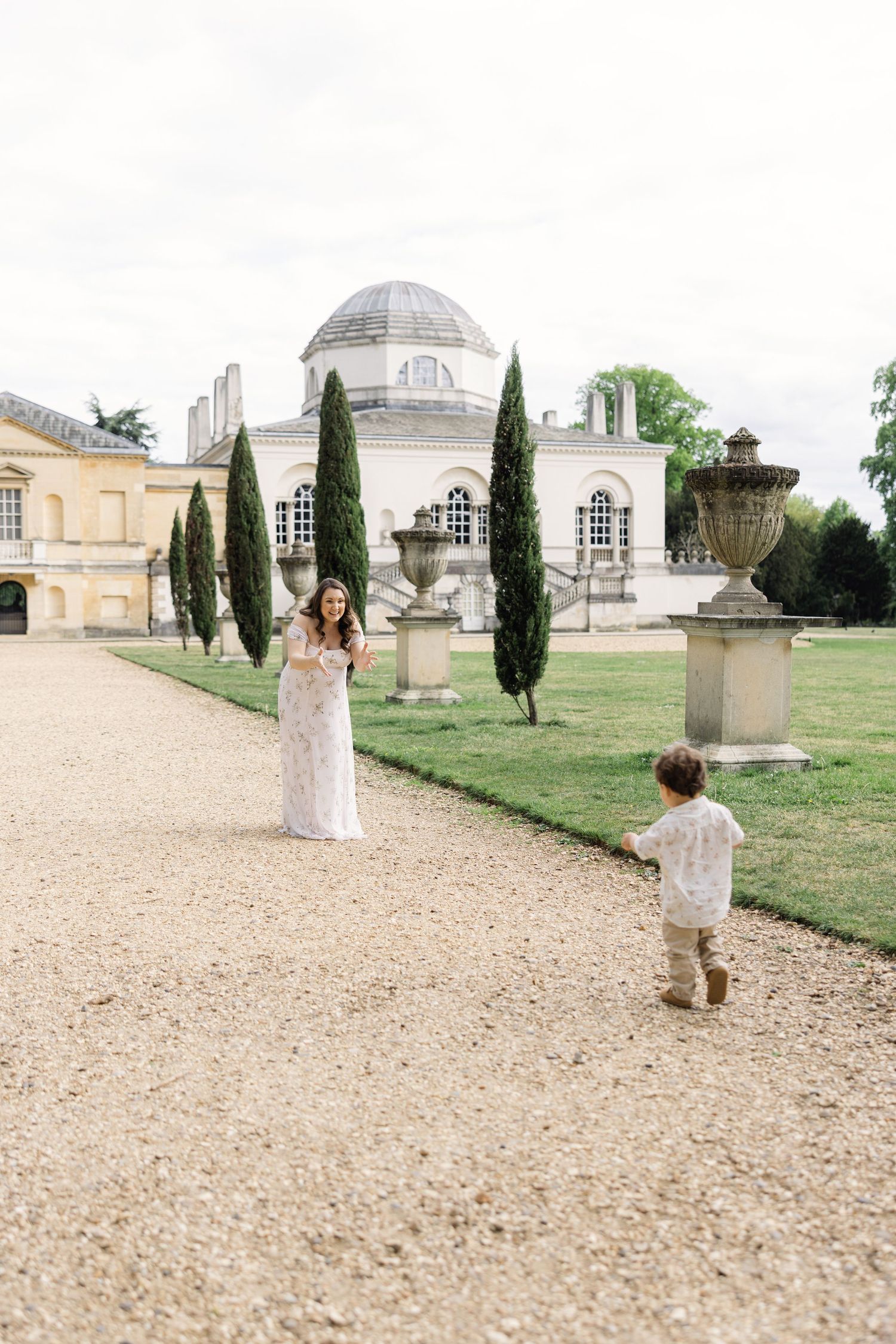 Mother and son playing in front of Chiswick House in the Garden during a family photosession in West London.